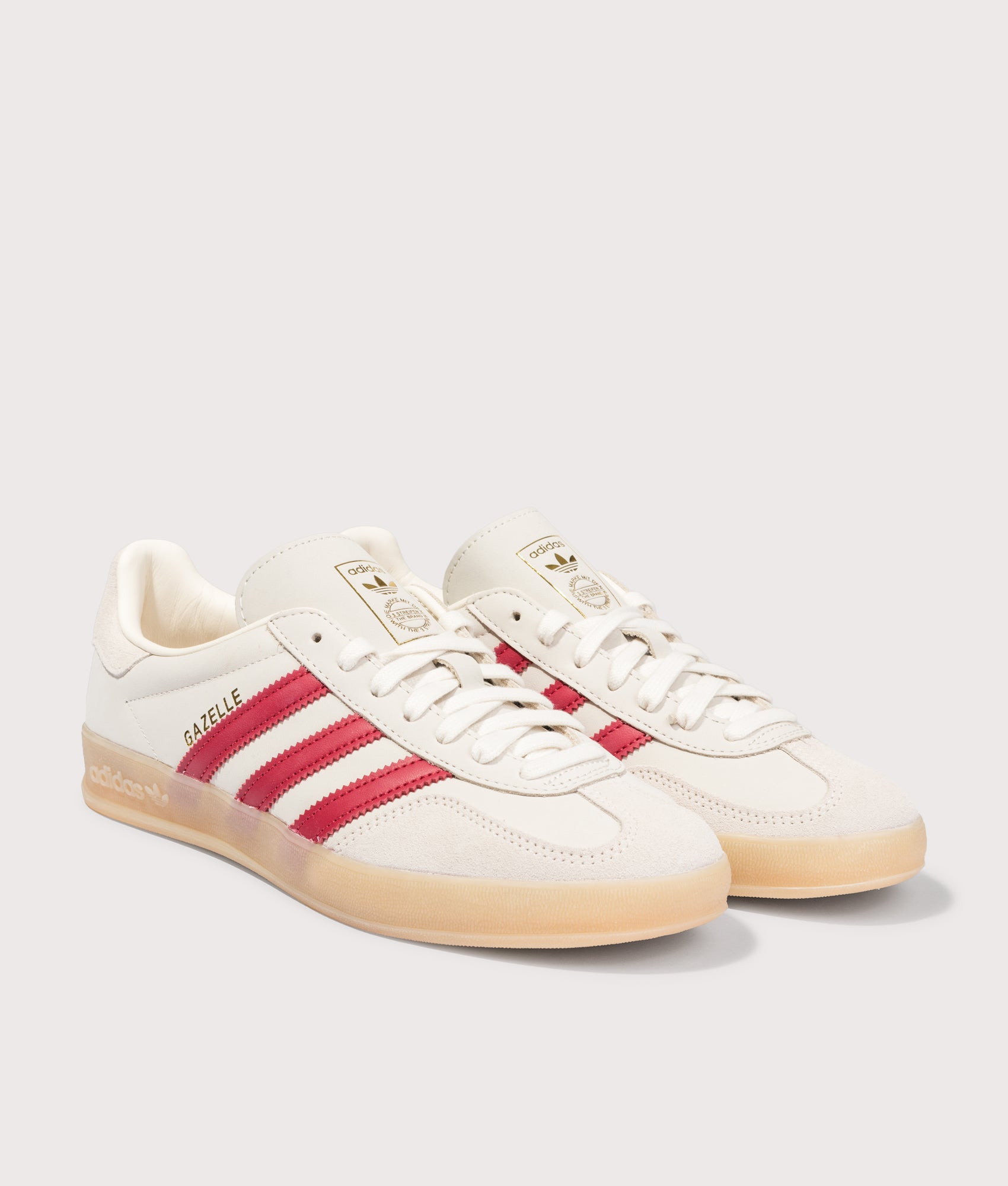 adidas Originals Gazelle Indoor Trainers in Cream White, Team Victory Red and Gum3 at EQVVS Menswear. Angled front shot.