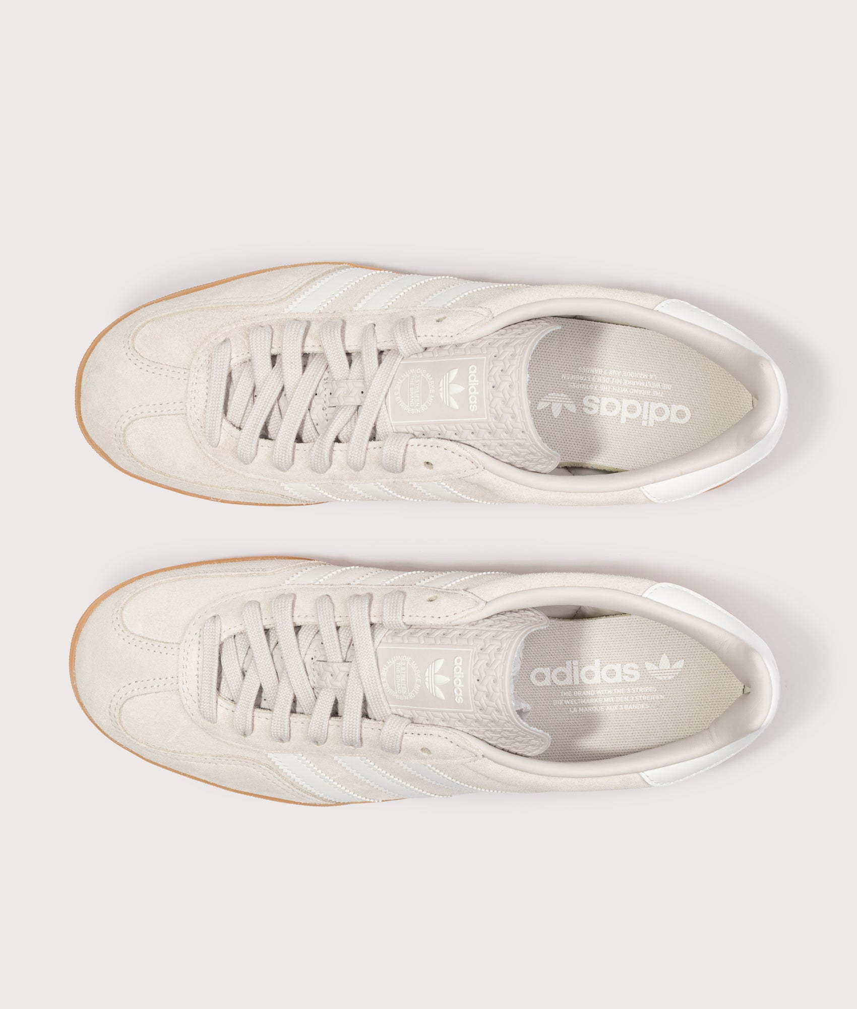 adidas Originals Gazelle Indoor Trainers in Chalk Pearl, Core White and Gum at EQVVS Menswear. Top shot.