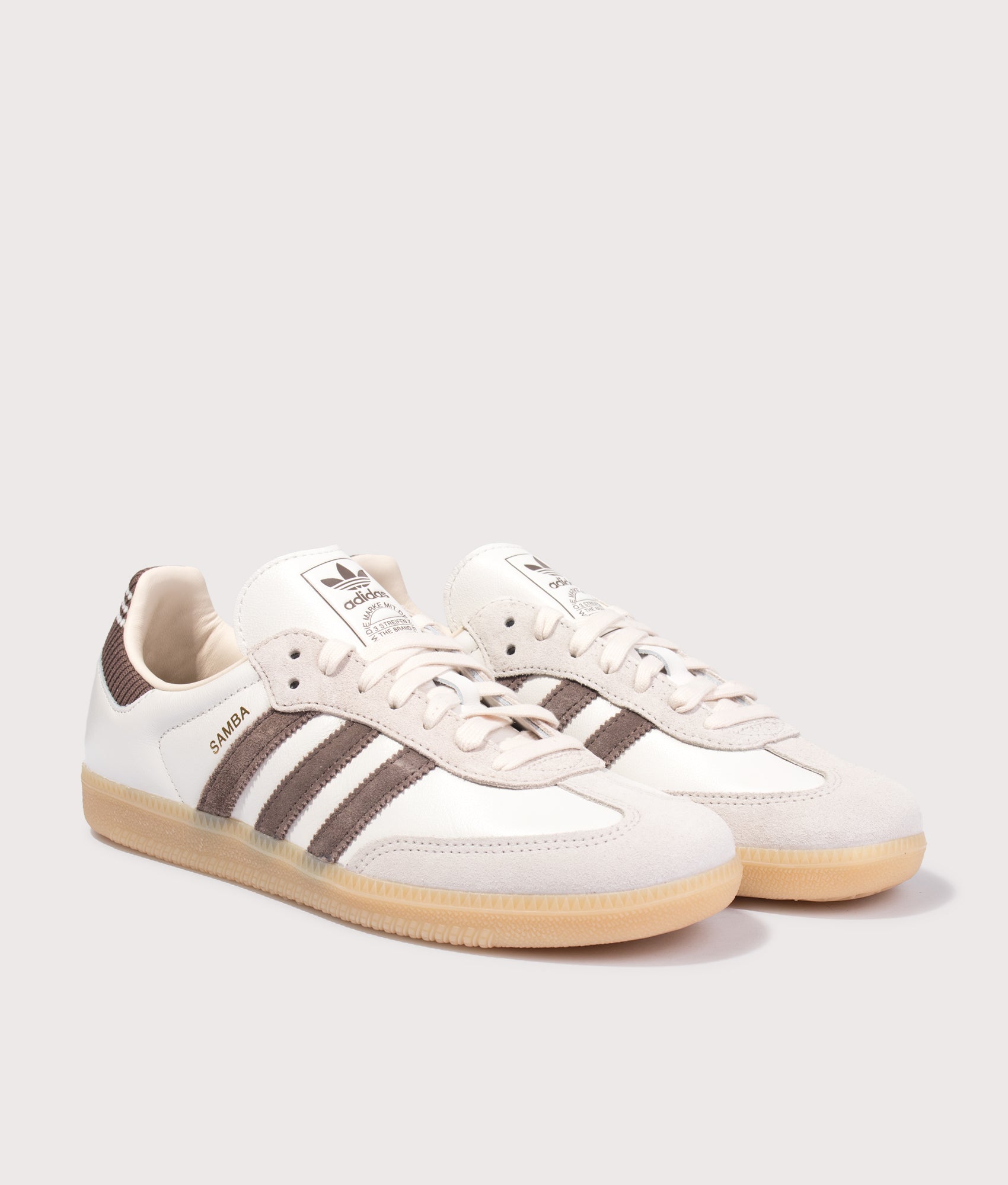 adidas Originals Samba OG Trainers in Cloud White, Earth Strata and Gum3 at EQVVS Menswear. Angled front shot.