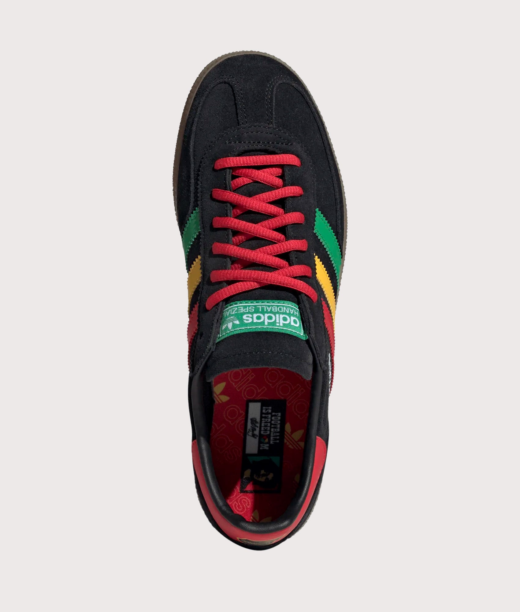 adidas Originals Jamaica X Bob Marley Handball Spezial Trainers in core Black, Pure Ruby and Bold Gold at EQVVS Menswear. Top shot.