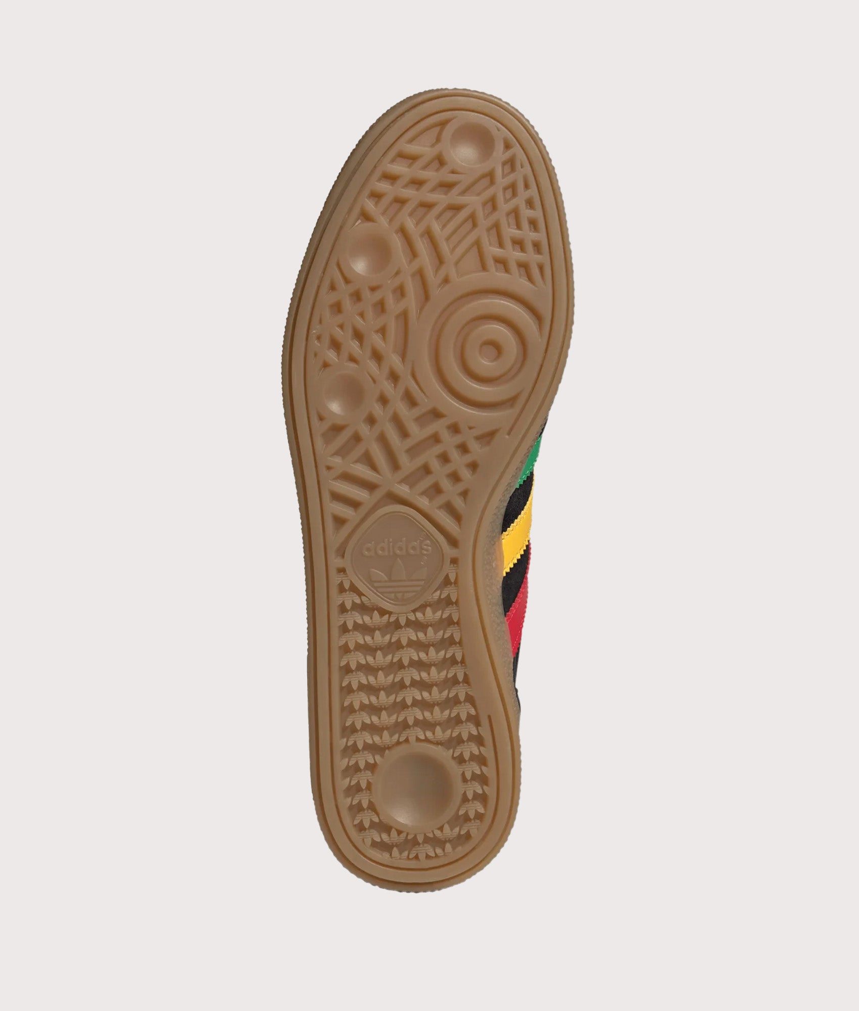 adidas Originals Jamaica X Bob Marley Handball Spezial Trainers in core Black, Pure Ruby and Bold Gold at EQVVS Menswear. Tread shot.