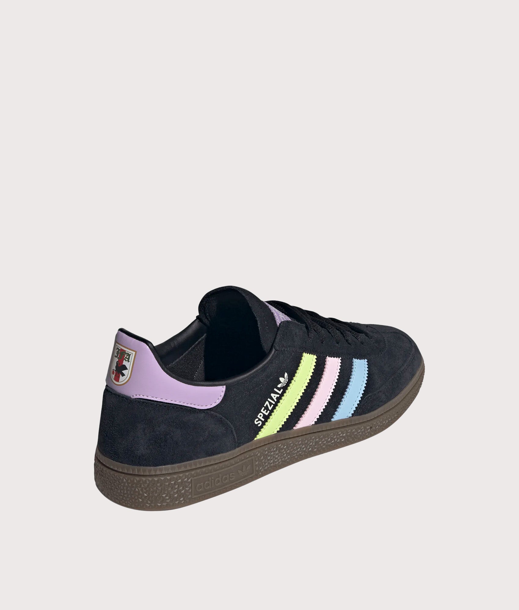 adidas Originals Japan Handball Spezial Trainers in Core Black, Glow Blue and Off White. Angled back shot.