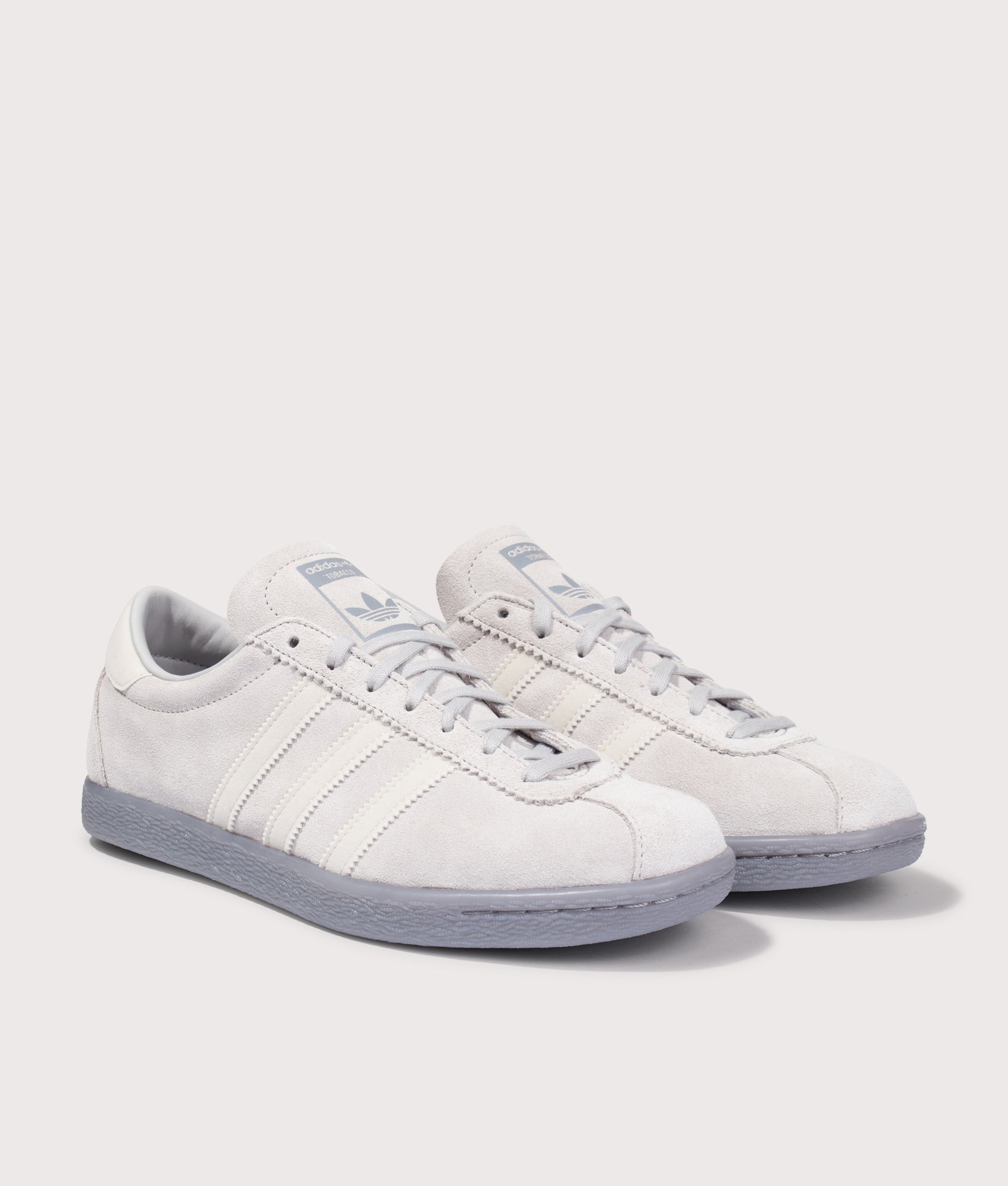 adidas Original Tobacco Trainers in Grey Two, Grey One and Grey at EQVVS Menswear. Angled front shot.