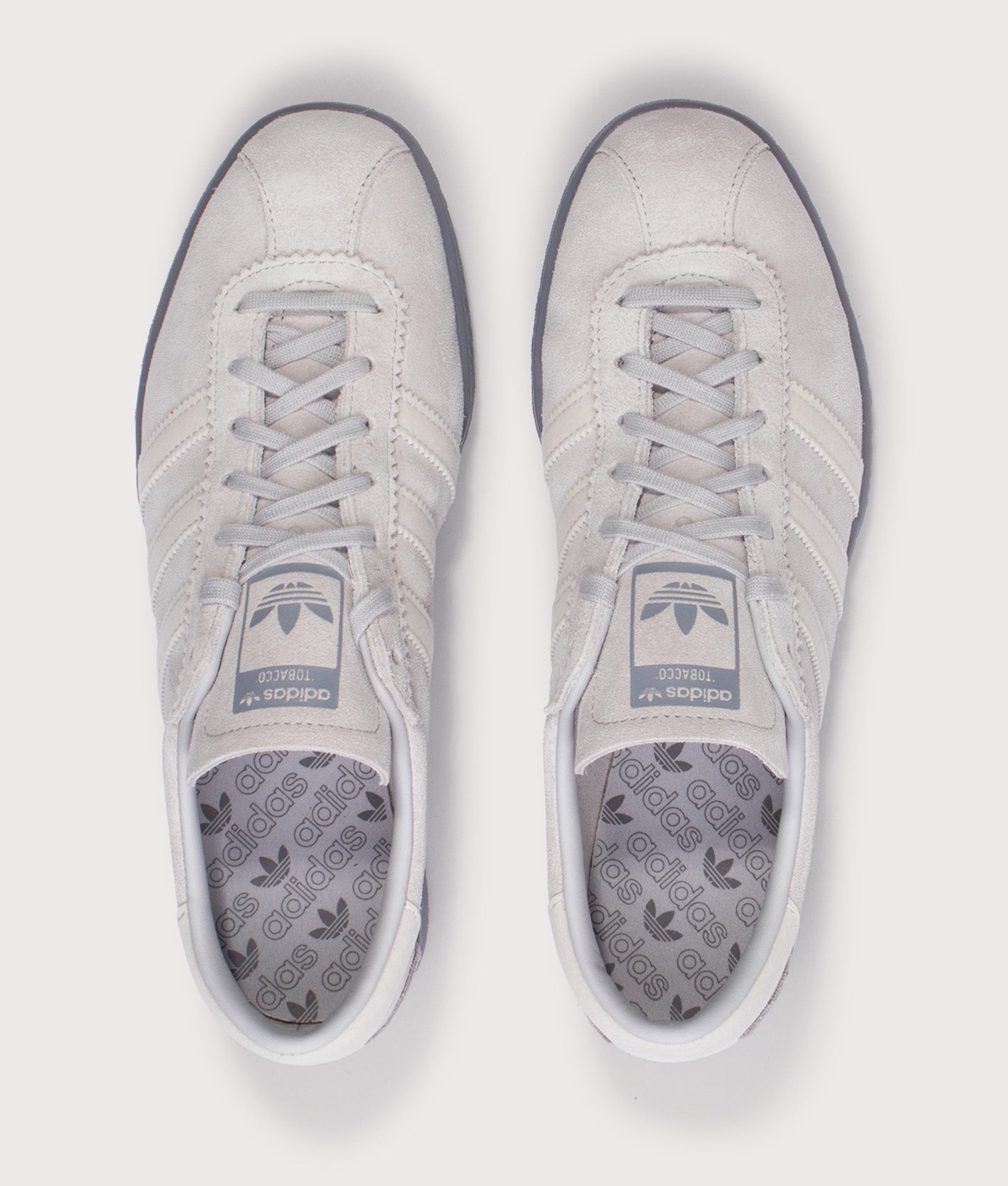 adidas Original Tobacco Trainers in Grey Two, Grey One and Grey at EQVVS Menswear. Top shot.