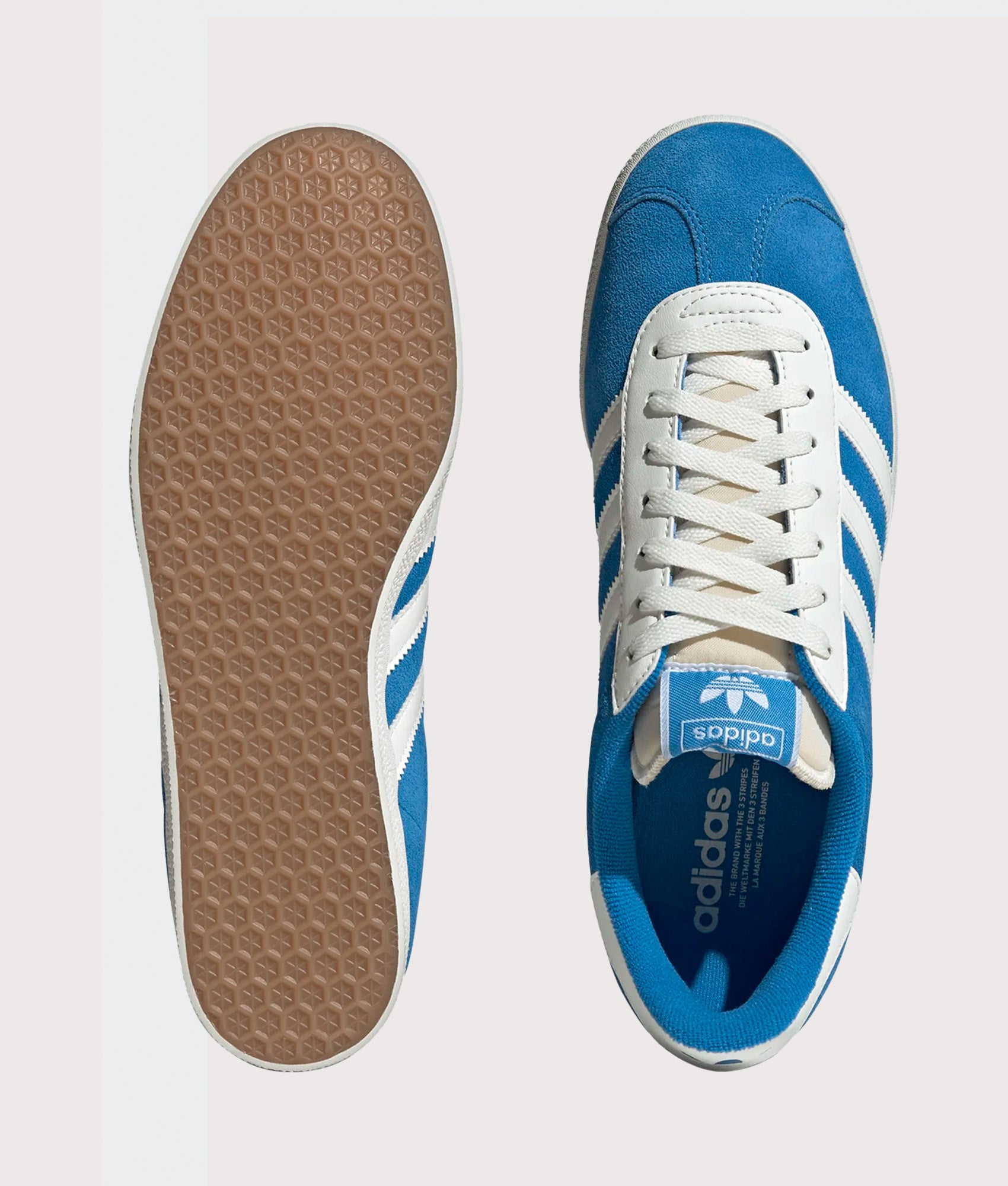 adidas Originals Gazelle Trainers in Bright Blue and Off White at EQVVS Menswear. Top and tread shot.