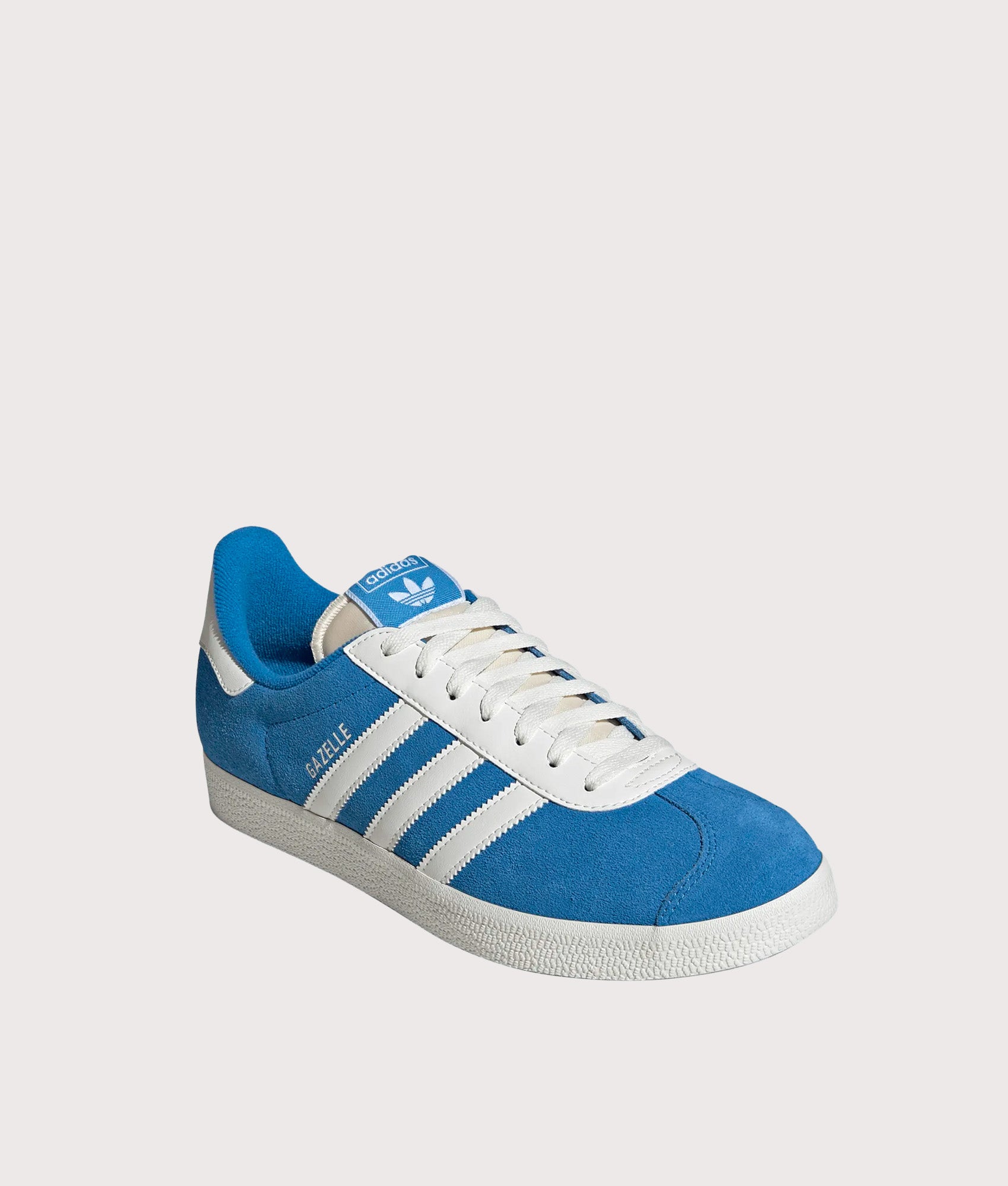 adidas Originals Gazelle Trainers in Bright Blue and Off White at EQVVS Menswear. Angled front shot.