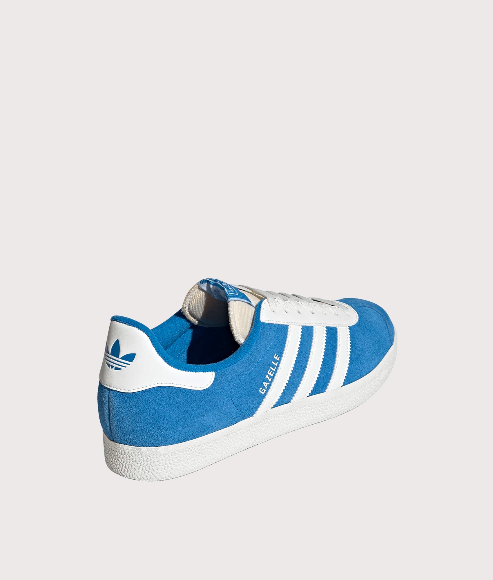 adidas Originals Gazelle Trainers in Bright Blue and Off White at EQVVS Menswear. Angled back shot.