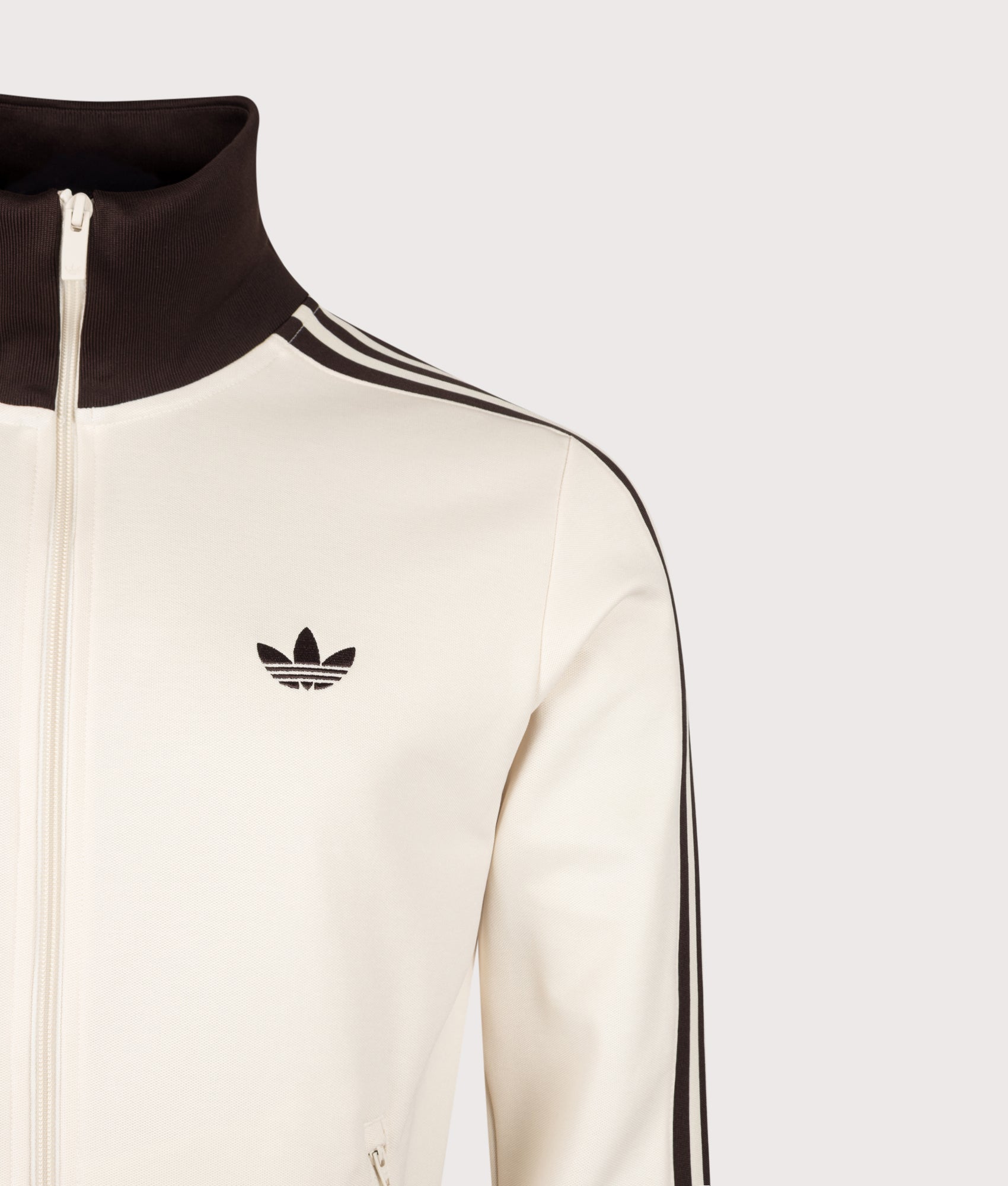 adidas Originals Beckenbauer Classic Track Top in Wonder White and Aurora Coffee at EQVVS Menswear. Detail shot.