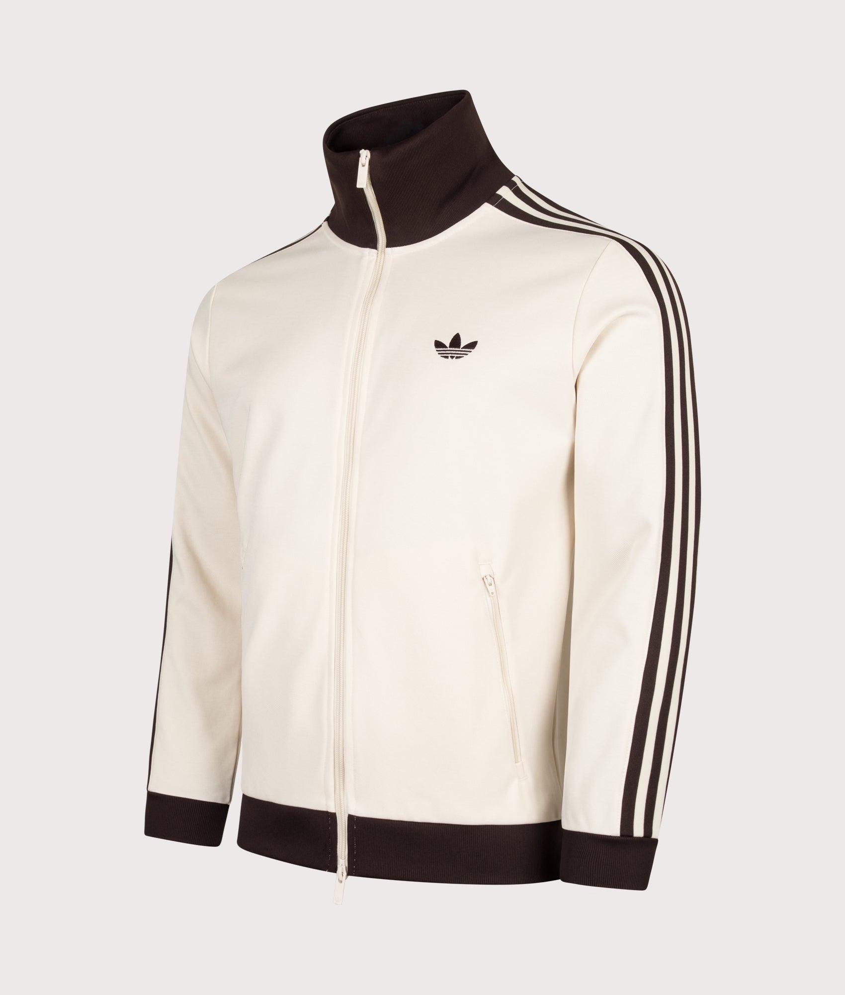adidas Originals Beckenbauer Classic Track Top in Wonder White and Aurora Coffee at EQVVS Menswear. Angled front shot.