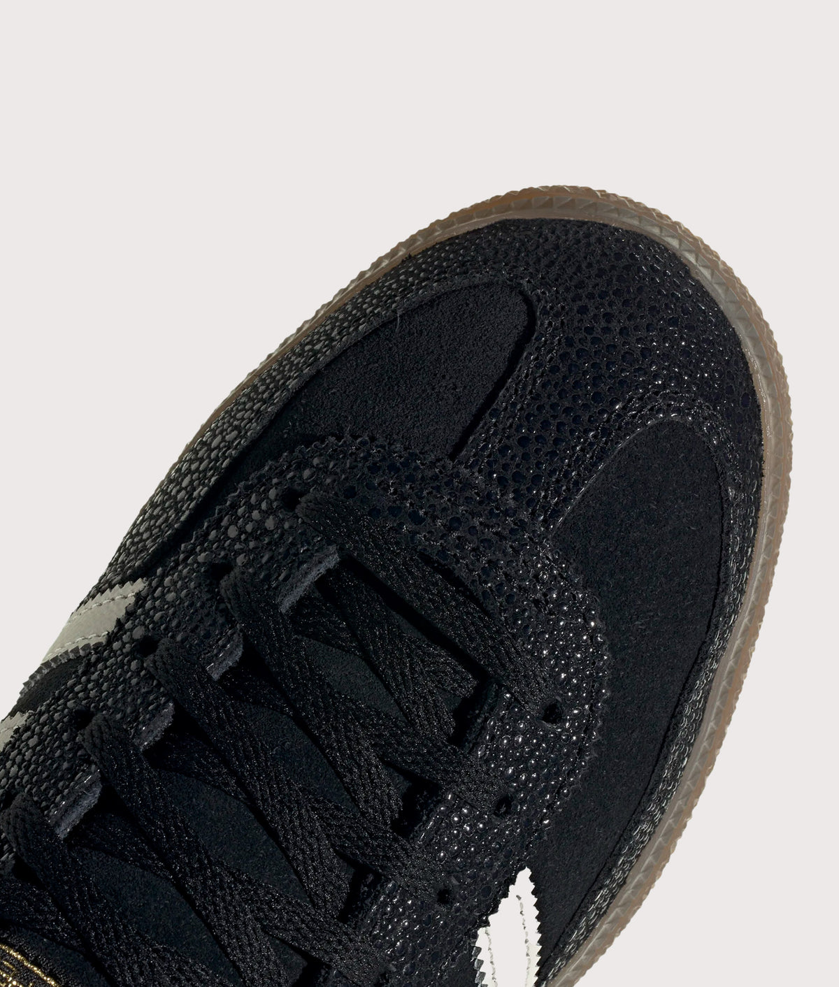 adidas Originals Handball Spezial Trainers in Core Black, Cloud White and Gold Metallic at EQVVS Menswear. Detail shot.