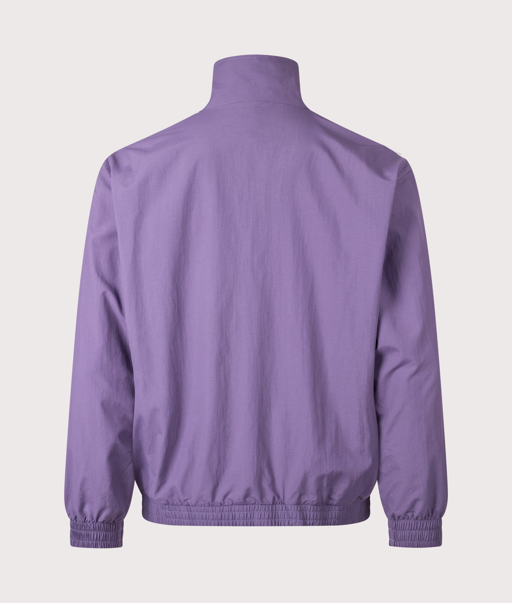 adidas Originals Firebird Woven Track Top in Tech Purple and White at EQVVS Menswear. Back shot.