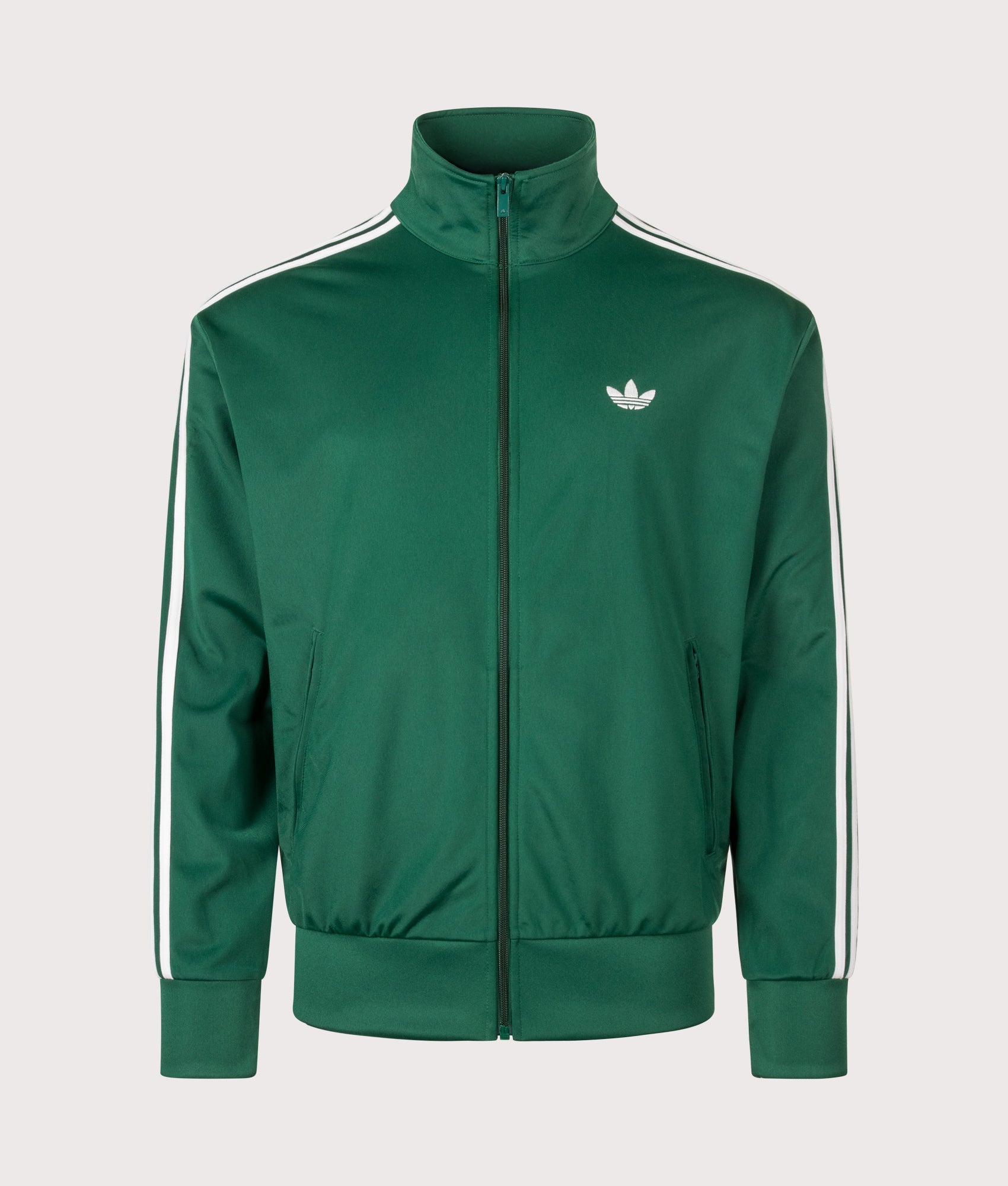 adidas Originals Loose Fit Firebird Track Top in Collegiate Green at EQVVS Menswear. Front shot.