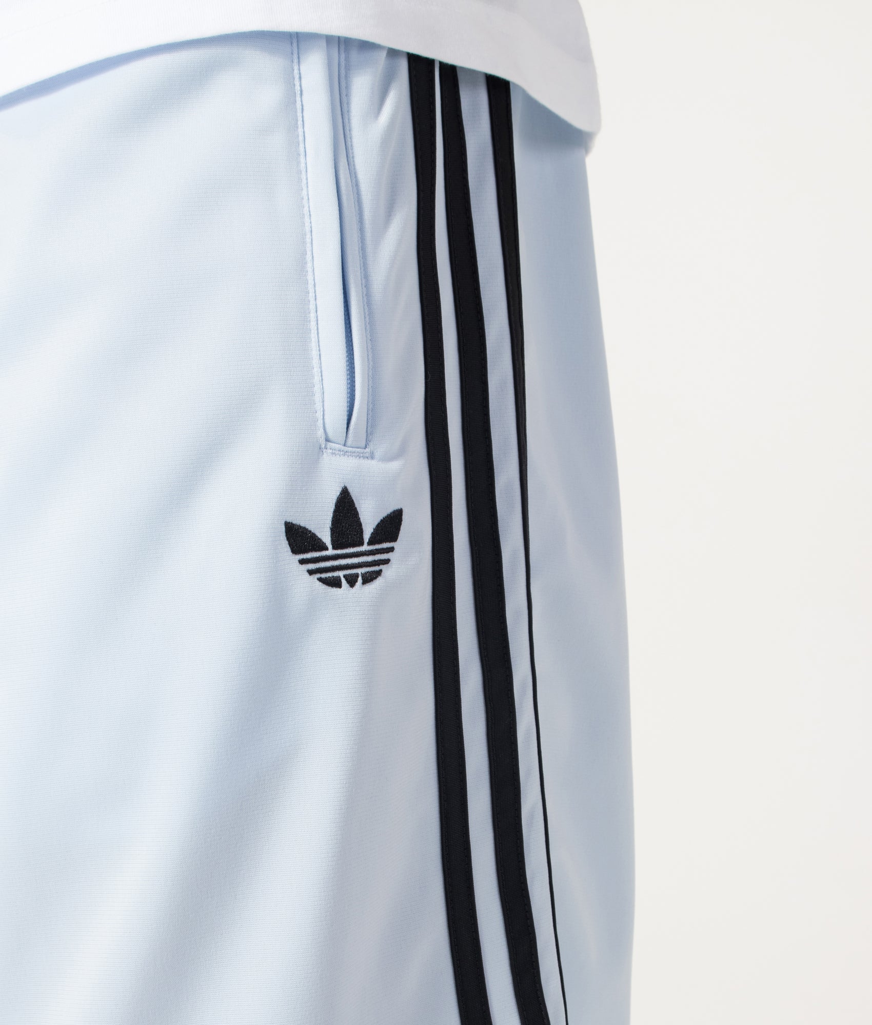 adidas Originals Firebird Shorts in Crystal Sky at EQVVS Menswear. Detail shot.