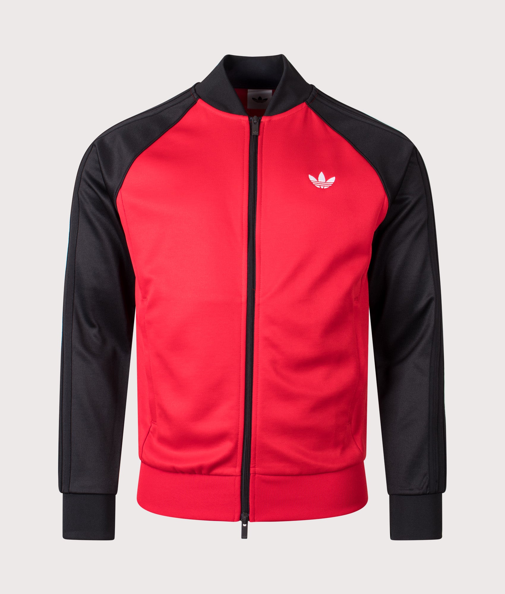 adidas Originals SST Track Top in Better Scarlet at EQVVS Menswear. Front shot.