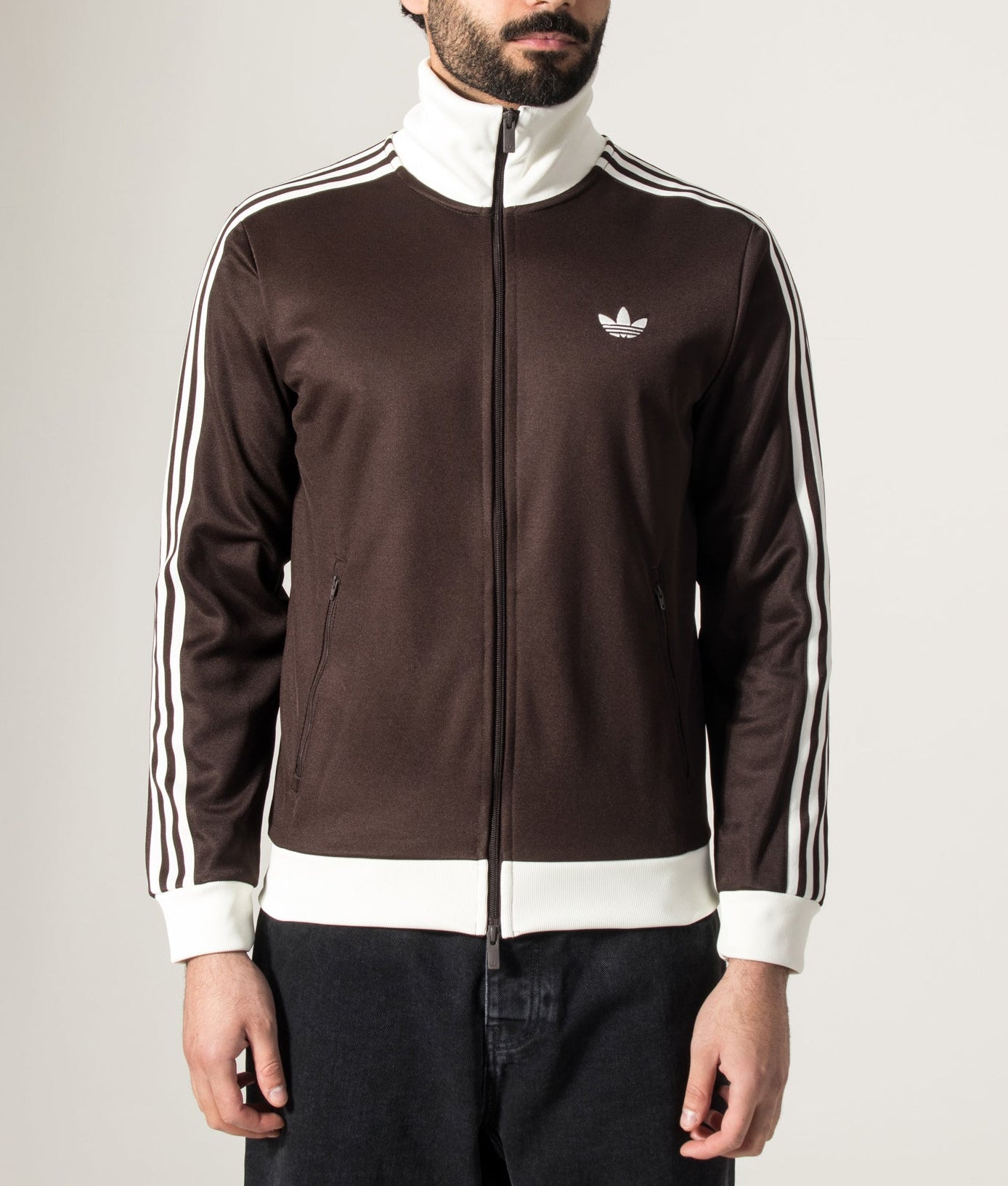 adidas Originals Beckenbauer Track Top in Aurora Coffee/Off White at EQVVS Menswear. Model front shot.