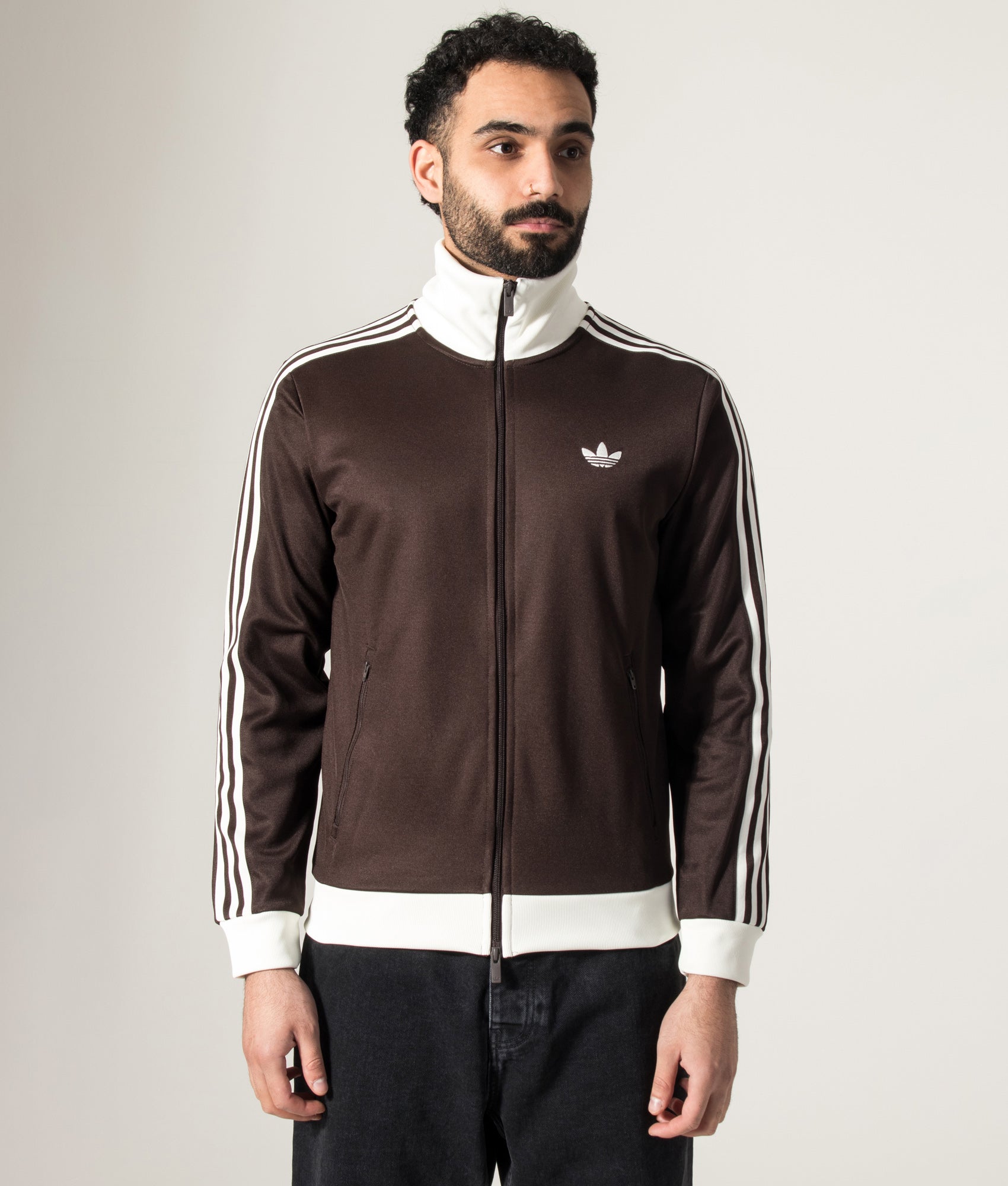 adidas Originals Beckenbauer Track Top in Aurora Coffee/Off White at EQVVS Menswear. Model front shot.