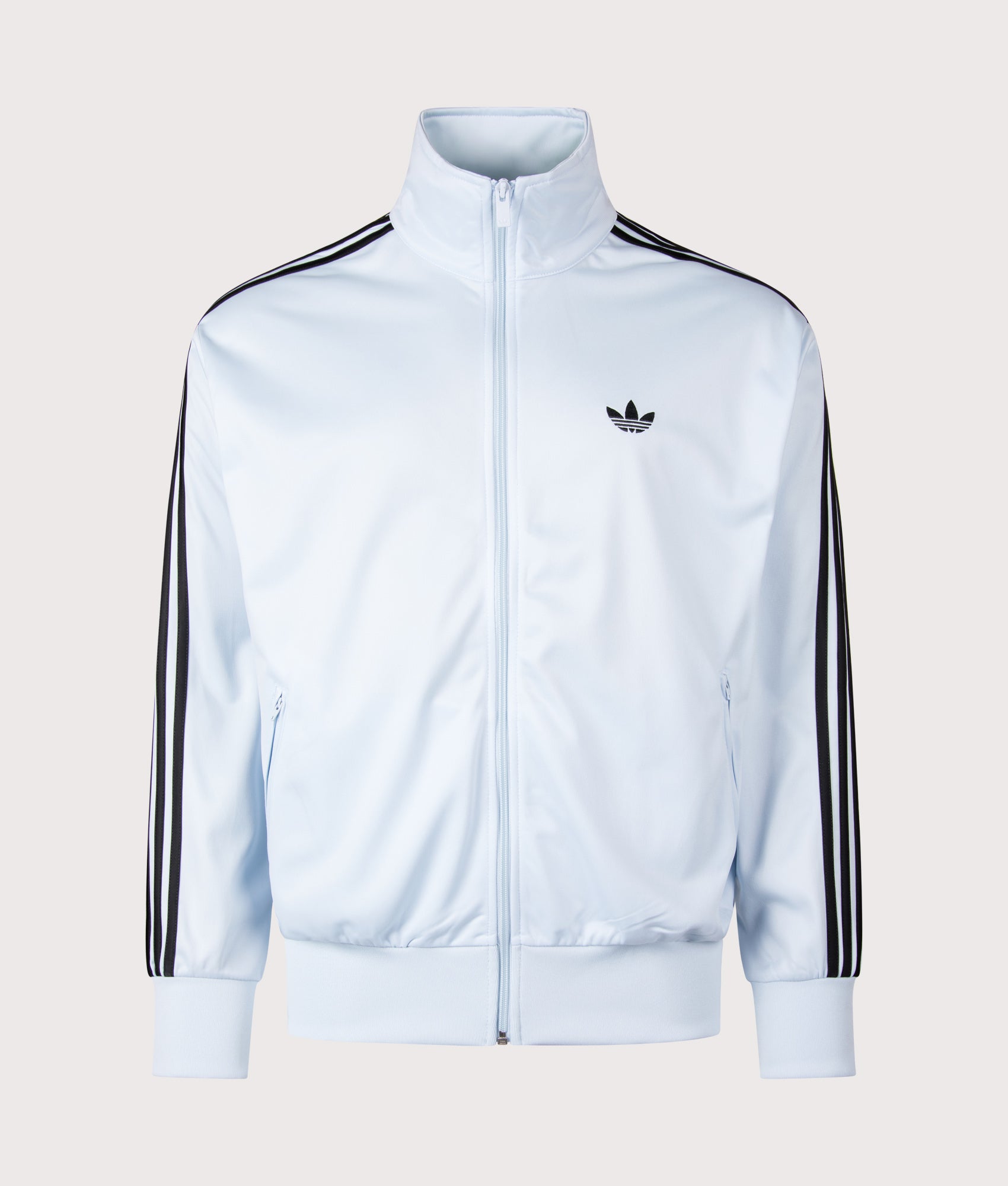 adidas Originals Loose Fit Firebird Track Top in Crystal Sky at EQVVS Menswear. Front shot.