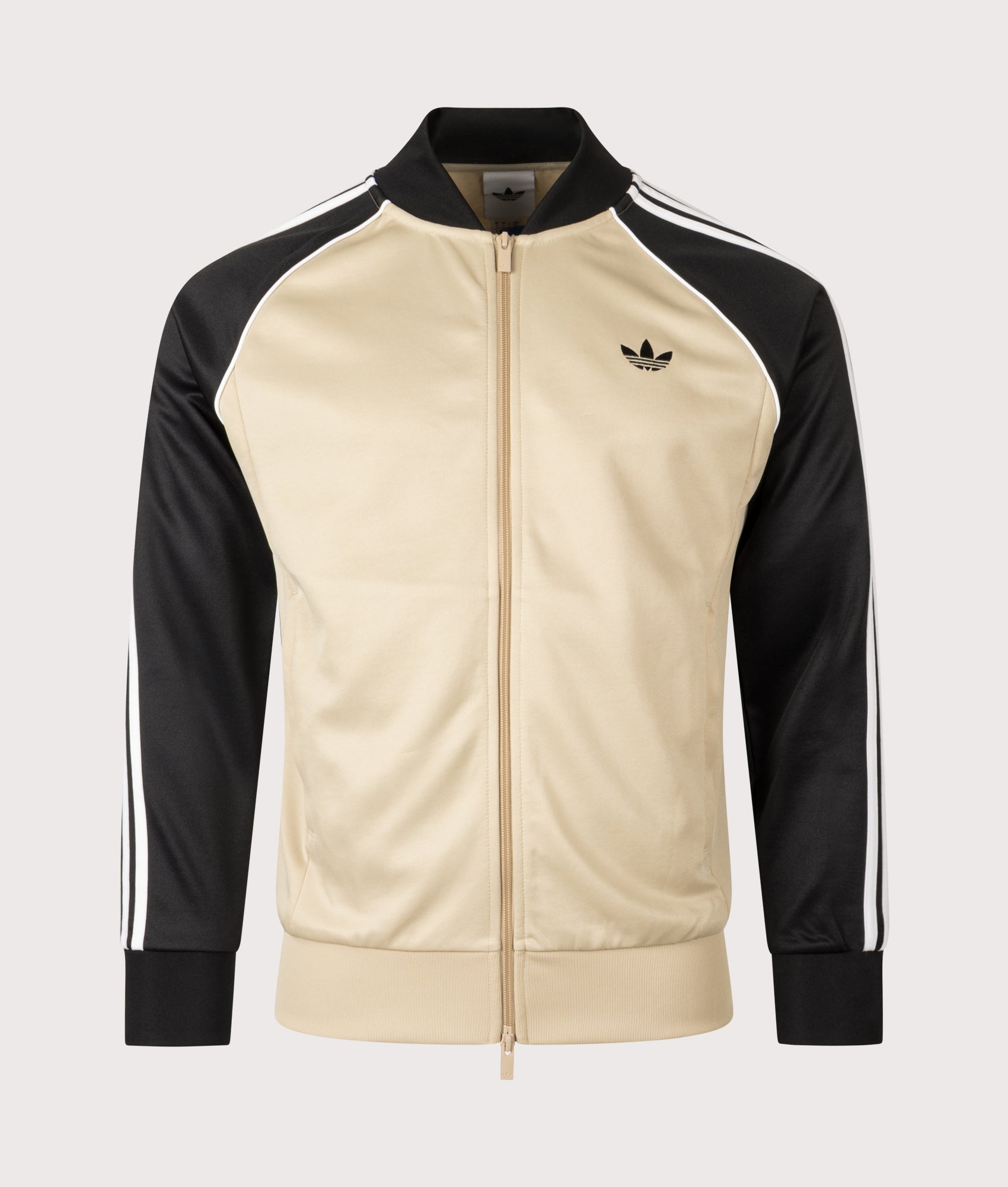 adidas Originals SST Track Top in Stone Khaki at EQVVS Menswear. Front shot.