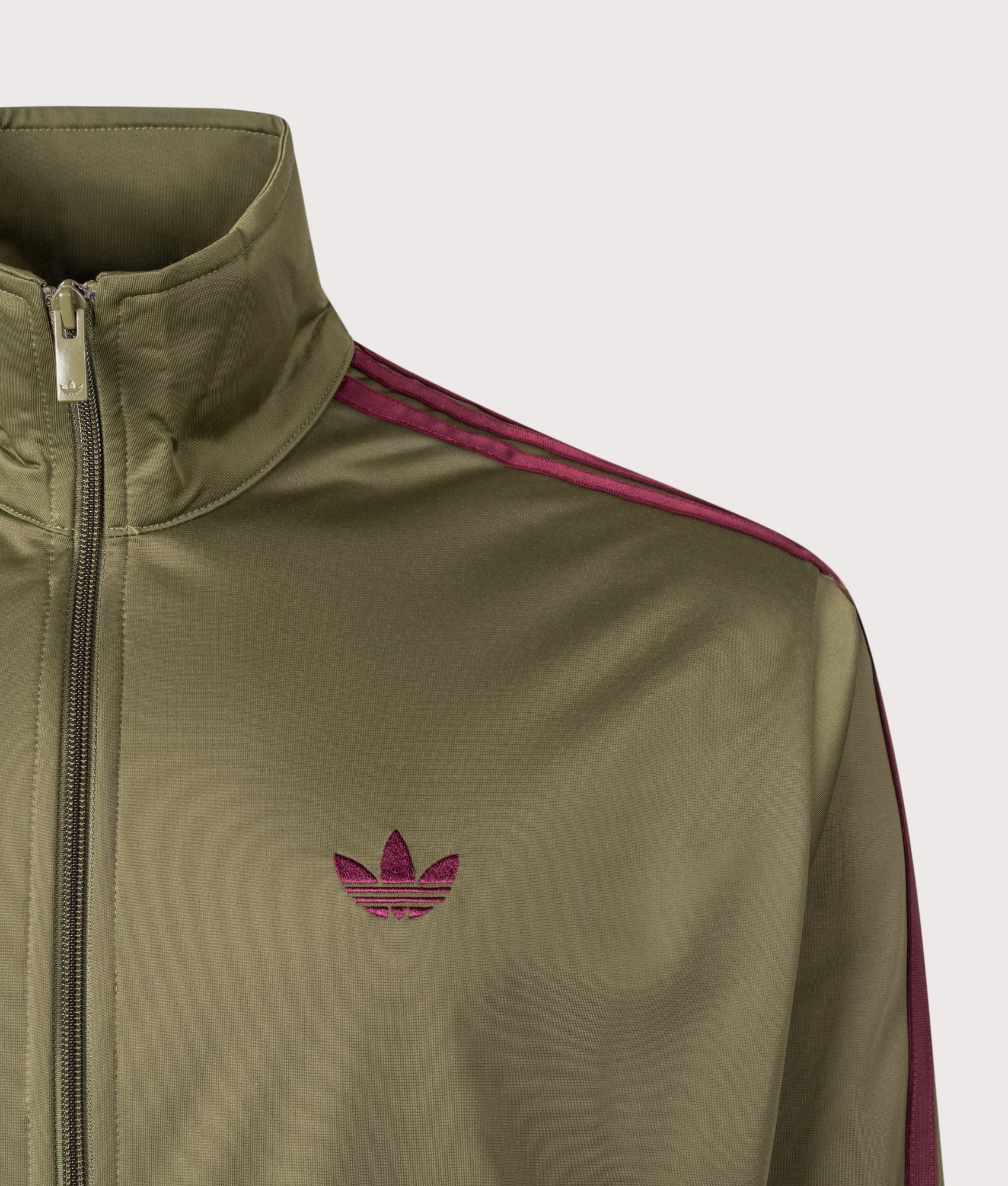 adidas Originals Firebird Track Top in Focus Olive and Maroon at EQVVS menswear. Detail shot.