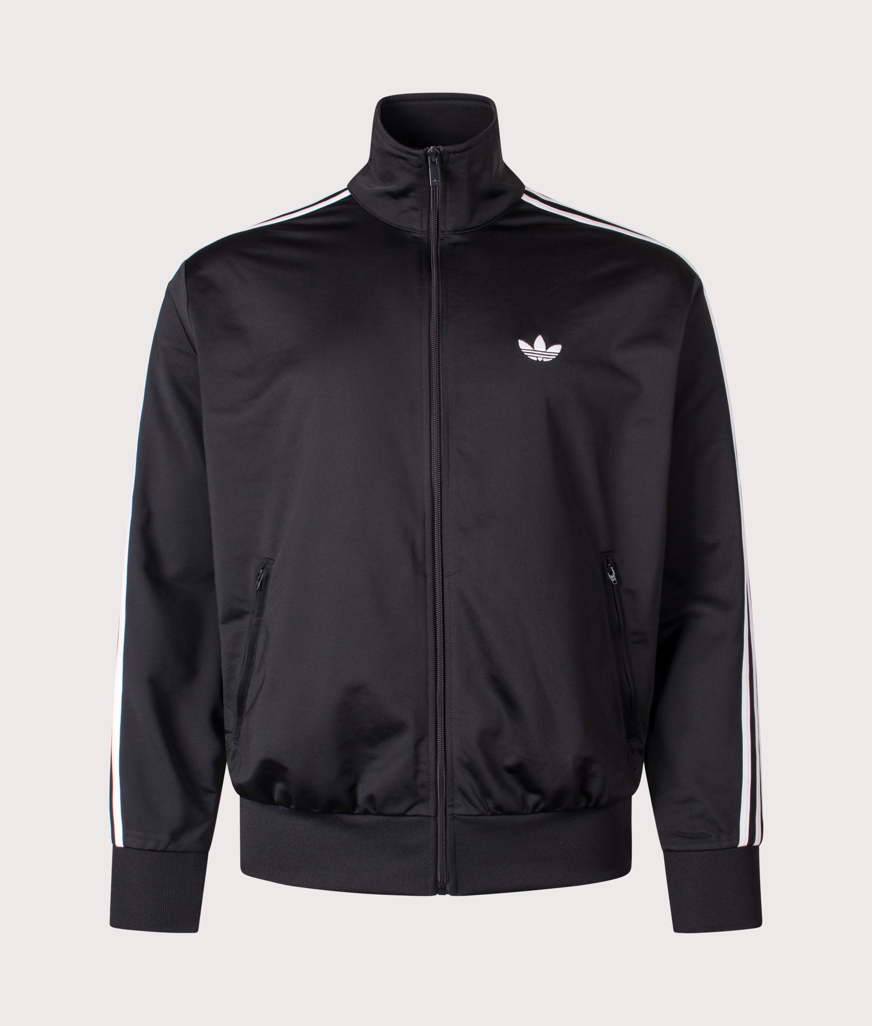 adidas Originals Firebird Track Top in Black at EQVVS Menswear. Front shot.
