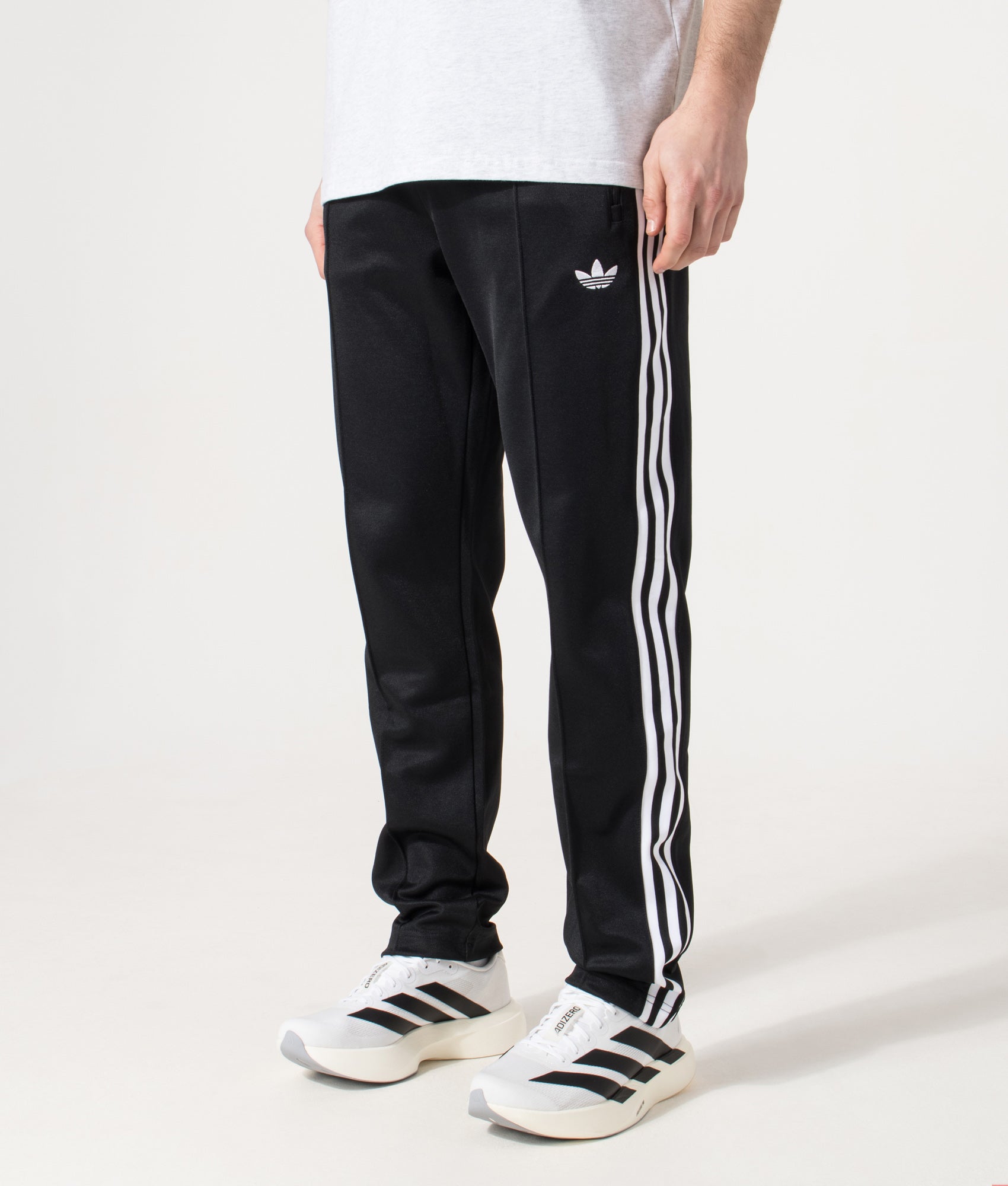 adidas Original Classic Track pant in  Black at EQVVS Menswear. Angled model front shot.