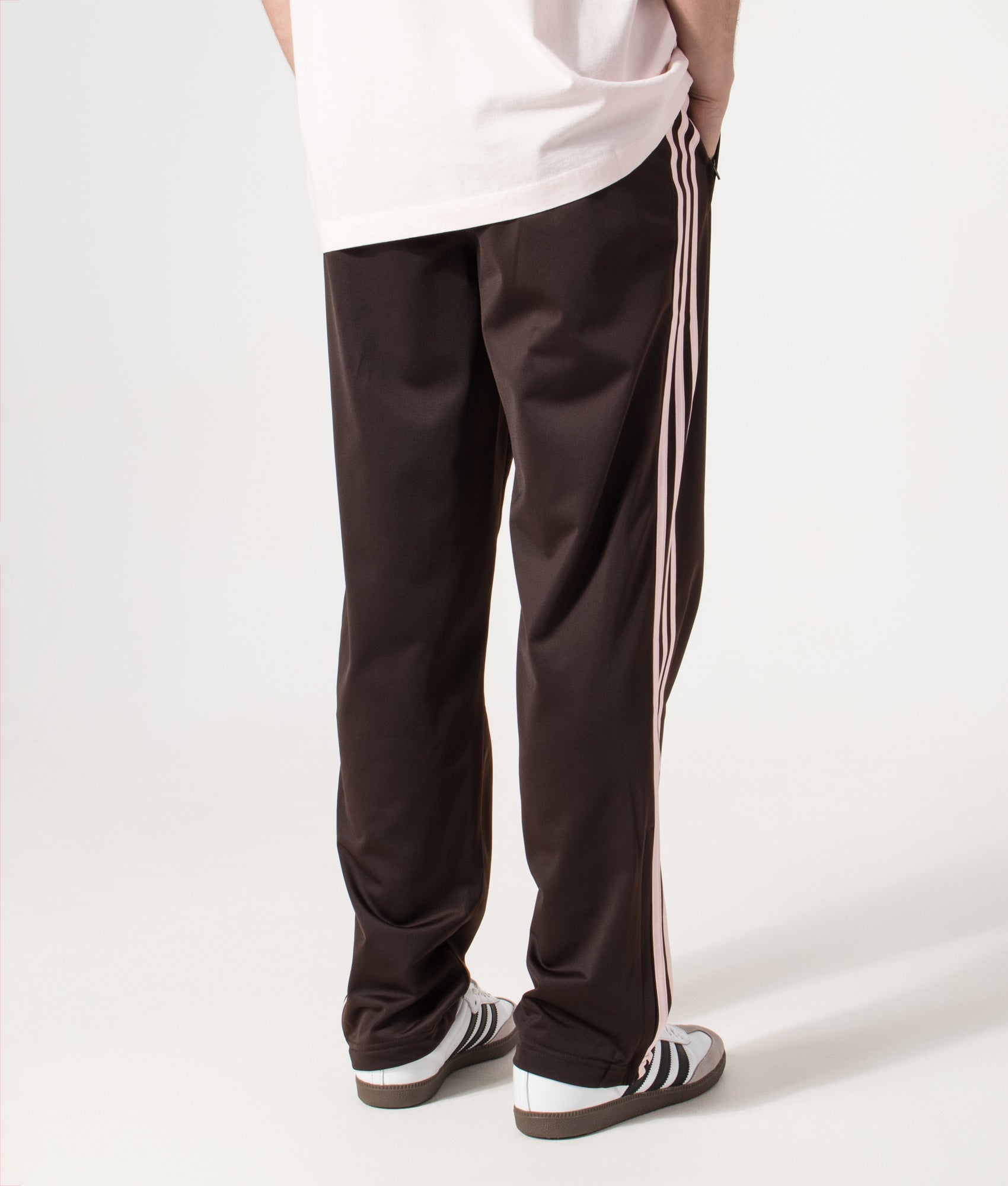 adidas Originals Firebird Track Pants in Aurora Coffee at EQVVS Menswear. Model back shot.