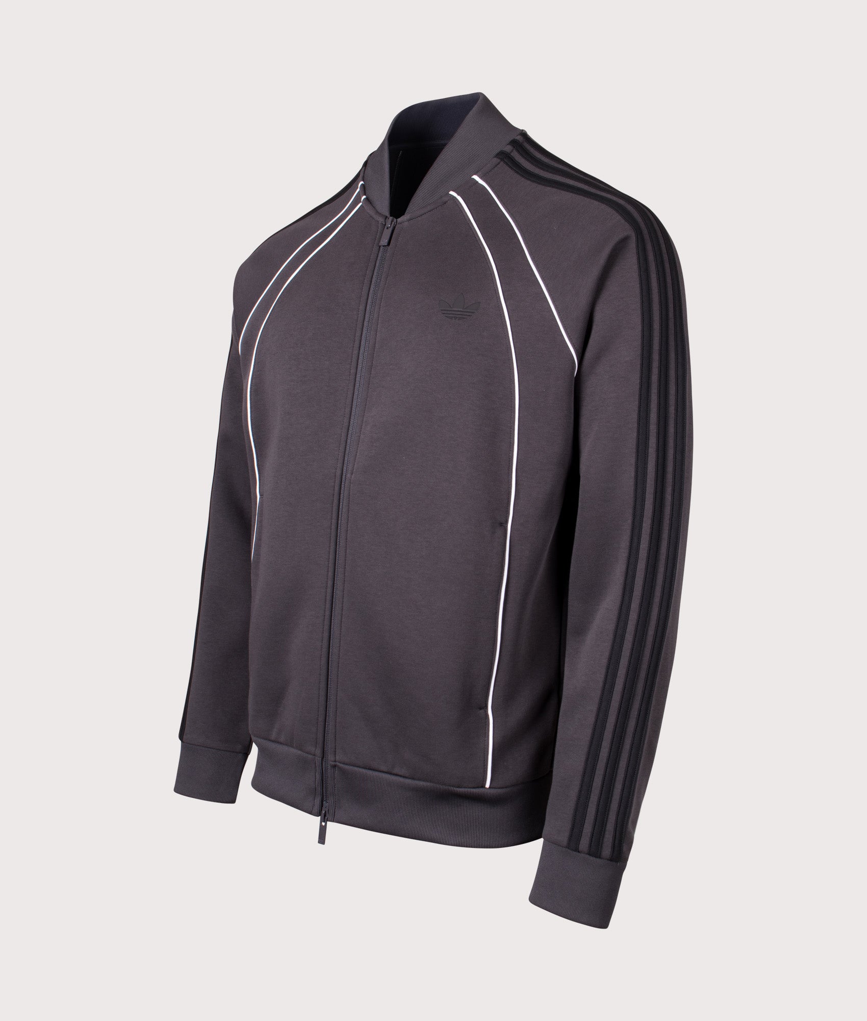 adidas Originals SST 2.0 Track Top in Anthracite Grey at EQVVS Menswear. Angled front shot.