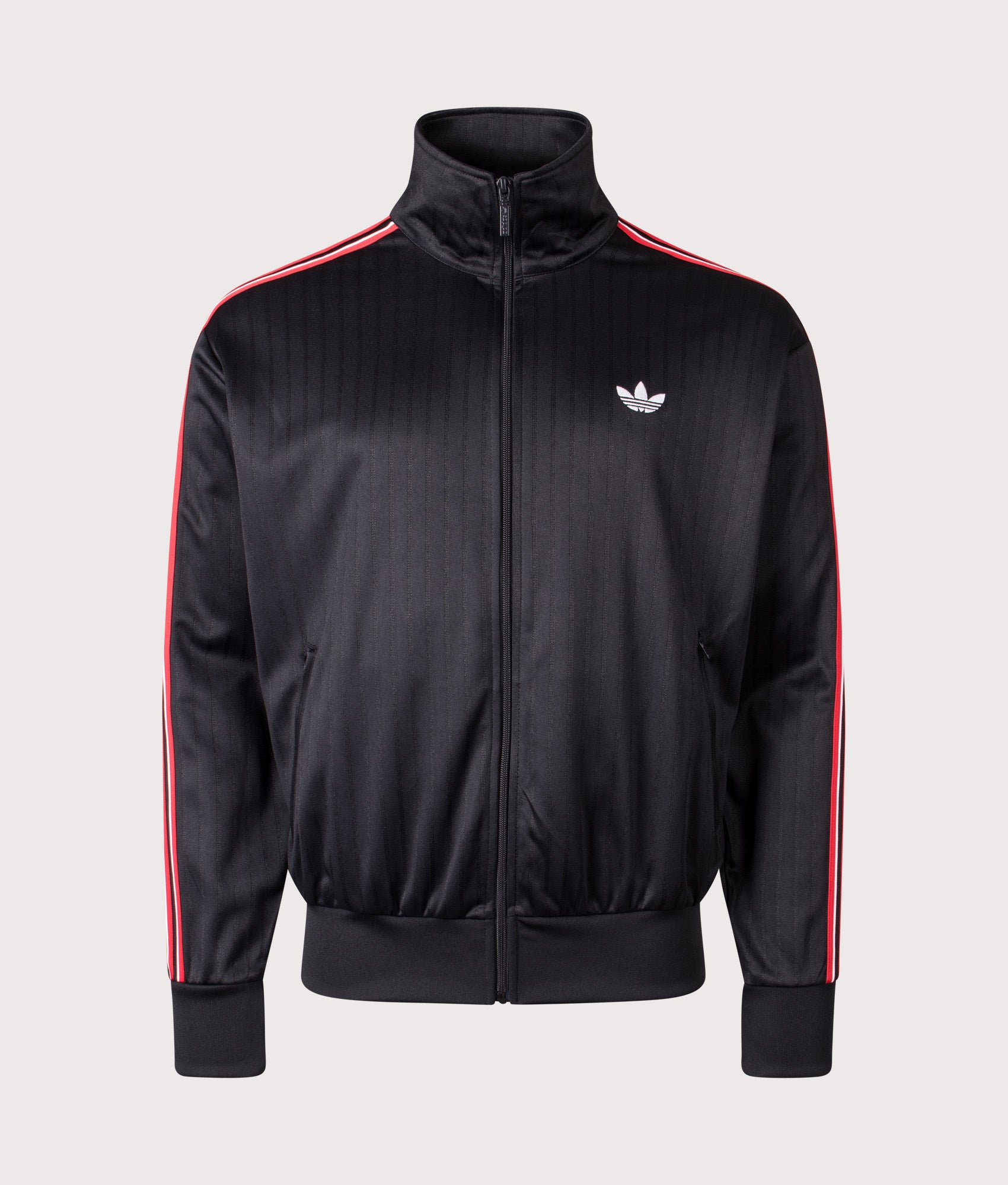 adidas Originals Firebird Pinstripe Track Top in Black at EQVVS Menswear. Front shot.