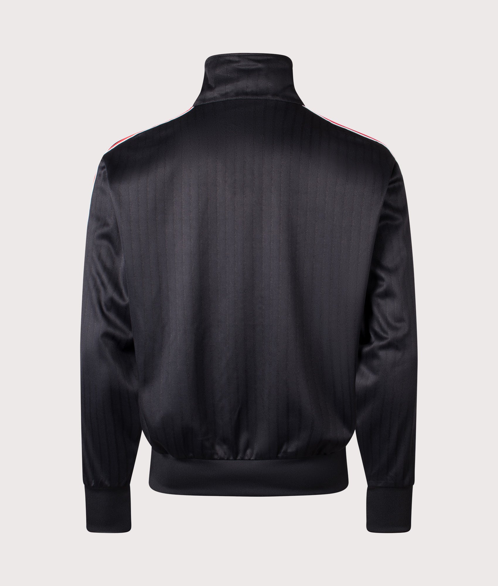 adidas Originals Firebird Pinstripe Track Top in Black at EQVVS Menswear. Back shot.