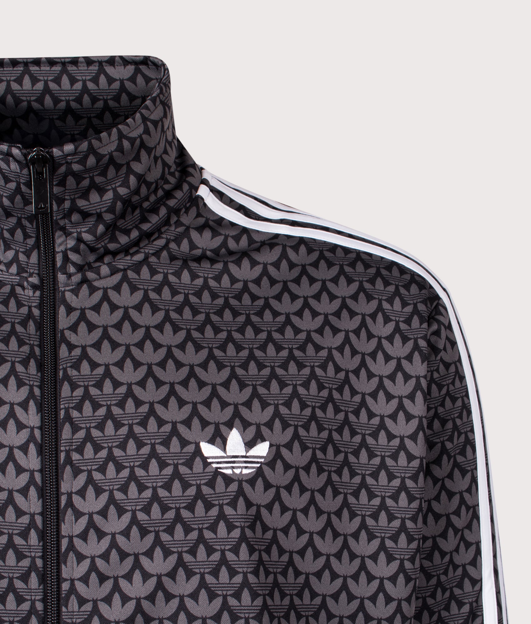 adidas Originals Firebird Monogram Track Top in Black at EQVVS Menswear. Detail shot.