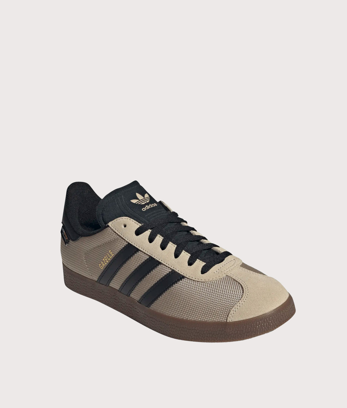 adidas Originals Cordura Gazelle Trainers in Khaki Three, Core Black and Gum 5 at EQVVS Menswear. Angled front shot.