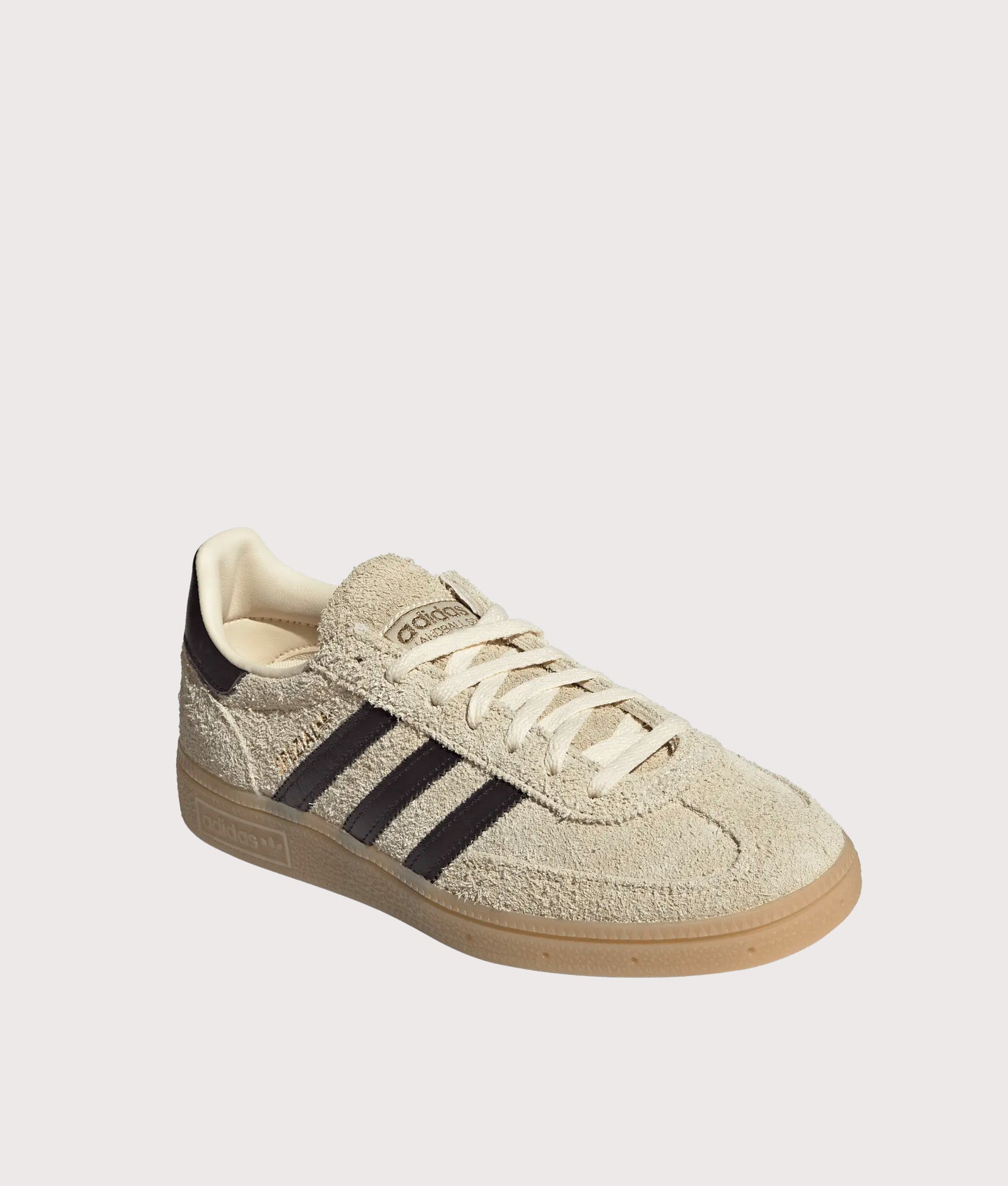 adidas Originals Handball Spezial Trainers in Warm Vanilla, Aurora Coffee and Gold Metallic at EQVVS Menswear. Angled front shot.