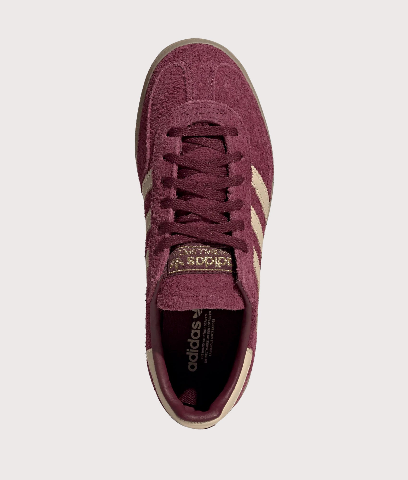 adidas Originals Handball Spezial Trainers in Maroon, Warm Vanilla and Gold Metallic at EQVVS Menswear. Top shot.