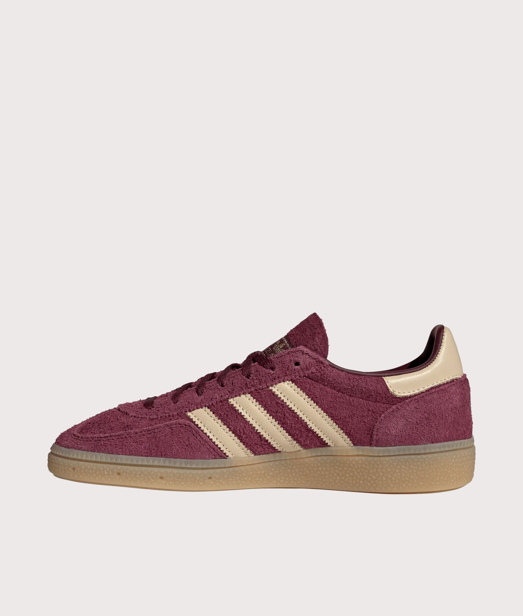 adidas Originals Handball Spezial Trainers in Maroon, Warm Vanilla and Gold Metallic at EQVVS Menswear. Side shot.