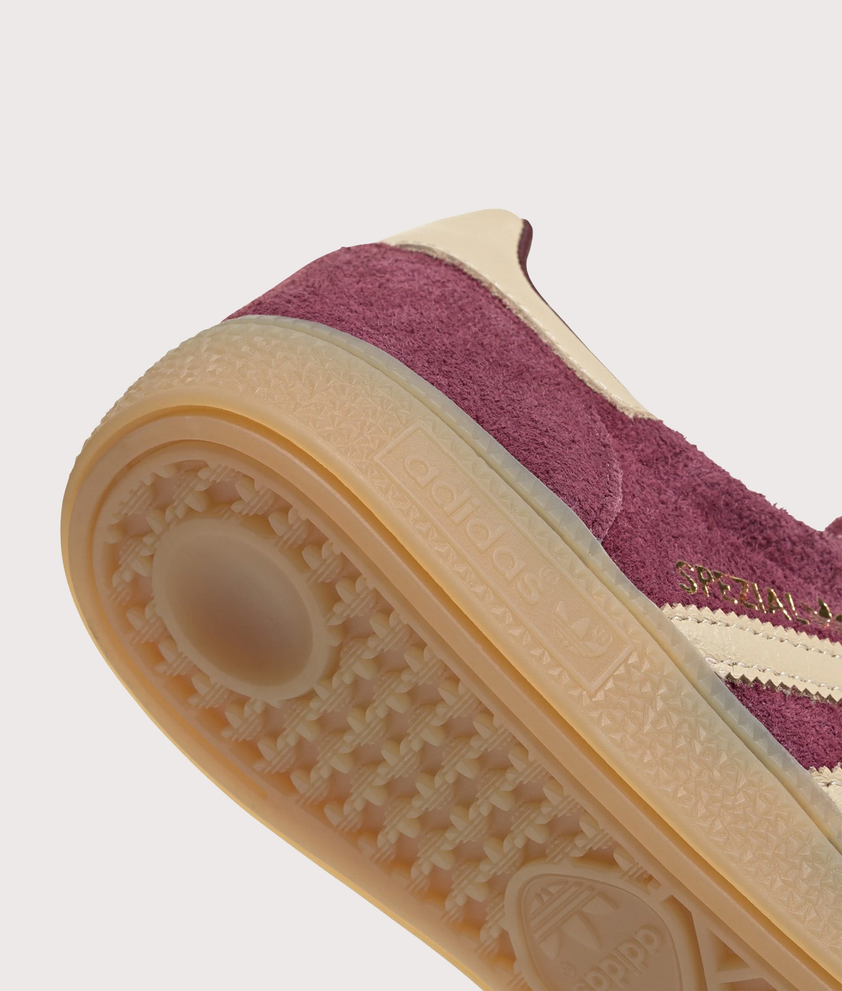 adidas Originals Handball Spezial Trainers in Maroon, Warm Vanilla and Gold Metallic at EQVVS Menswear. Detail shot.
