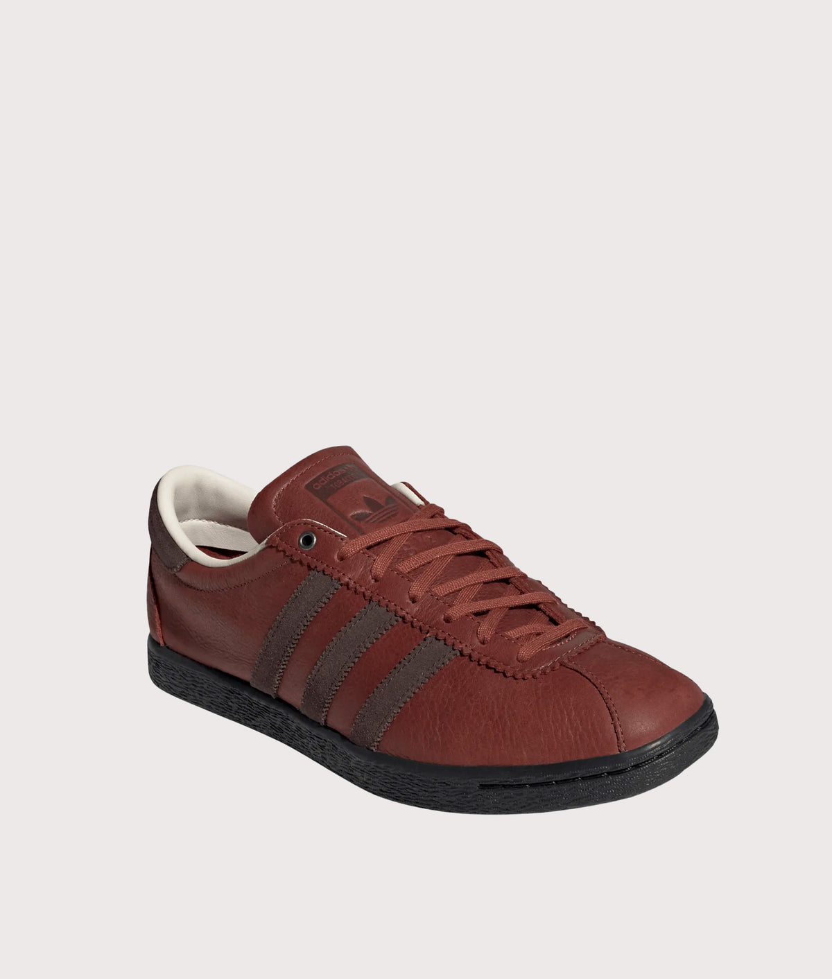  adidas Original Tobacco Trainers in Burnt Sienna, Dark Brown and Core Black at EQVVS Menswear. Angled front shot.