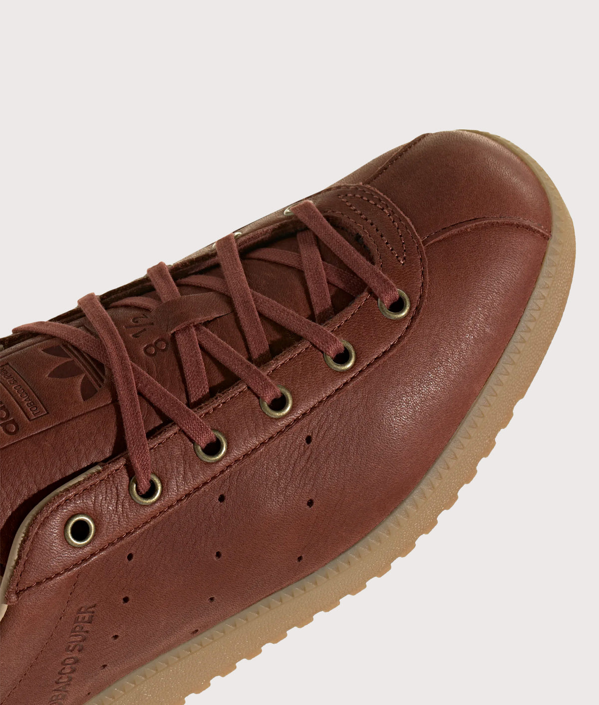 adidas Originals Tobacco Super Trainers in Fox Brown and Gum 4 at EQVVS Menswear. Detail shot.