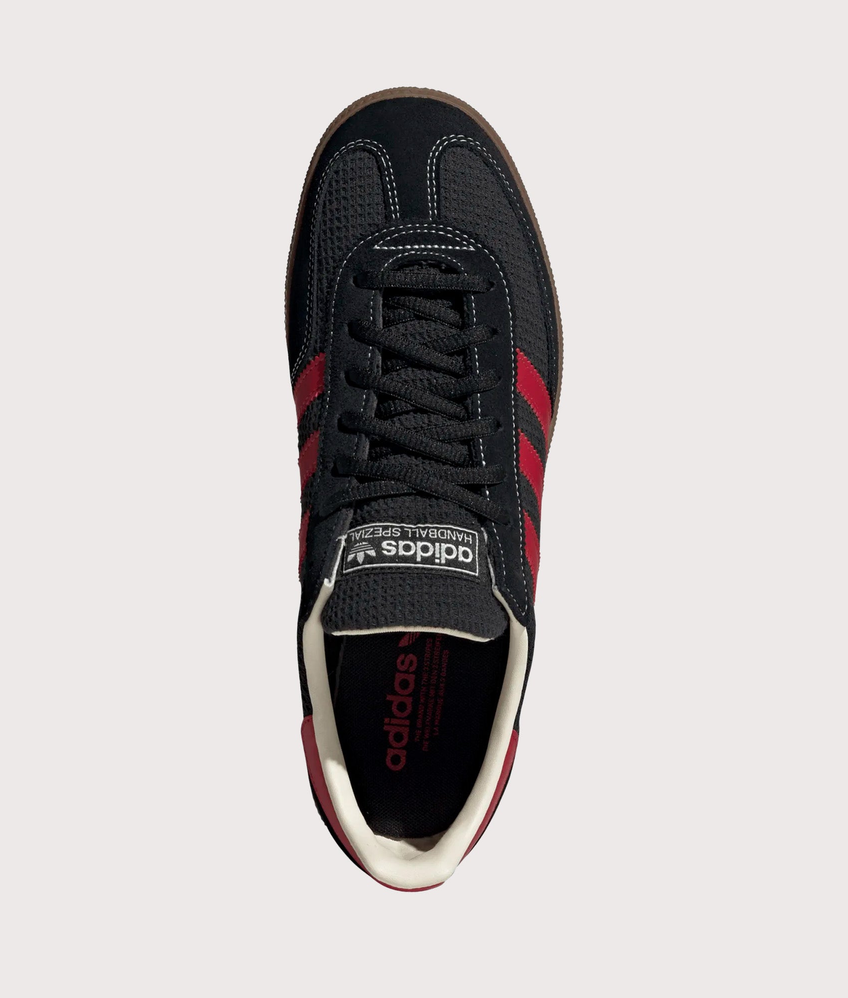 adidas Originals Handball Spezial Trainers in Core Black, Team Victory Red and Gum5 at EQVVS Menswear. Top shot.