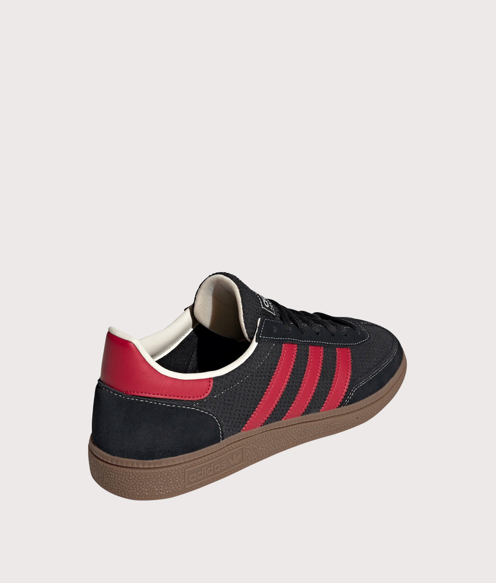 adidas Originals Handball Spezial Trainers in Core Black, Team Victory Red and Gum5 at EQVVS Menswear. Angled back shot.