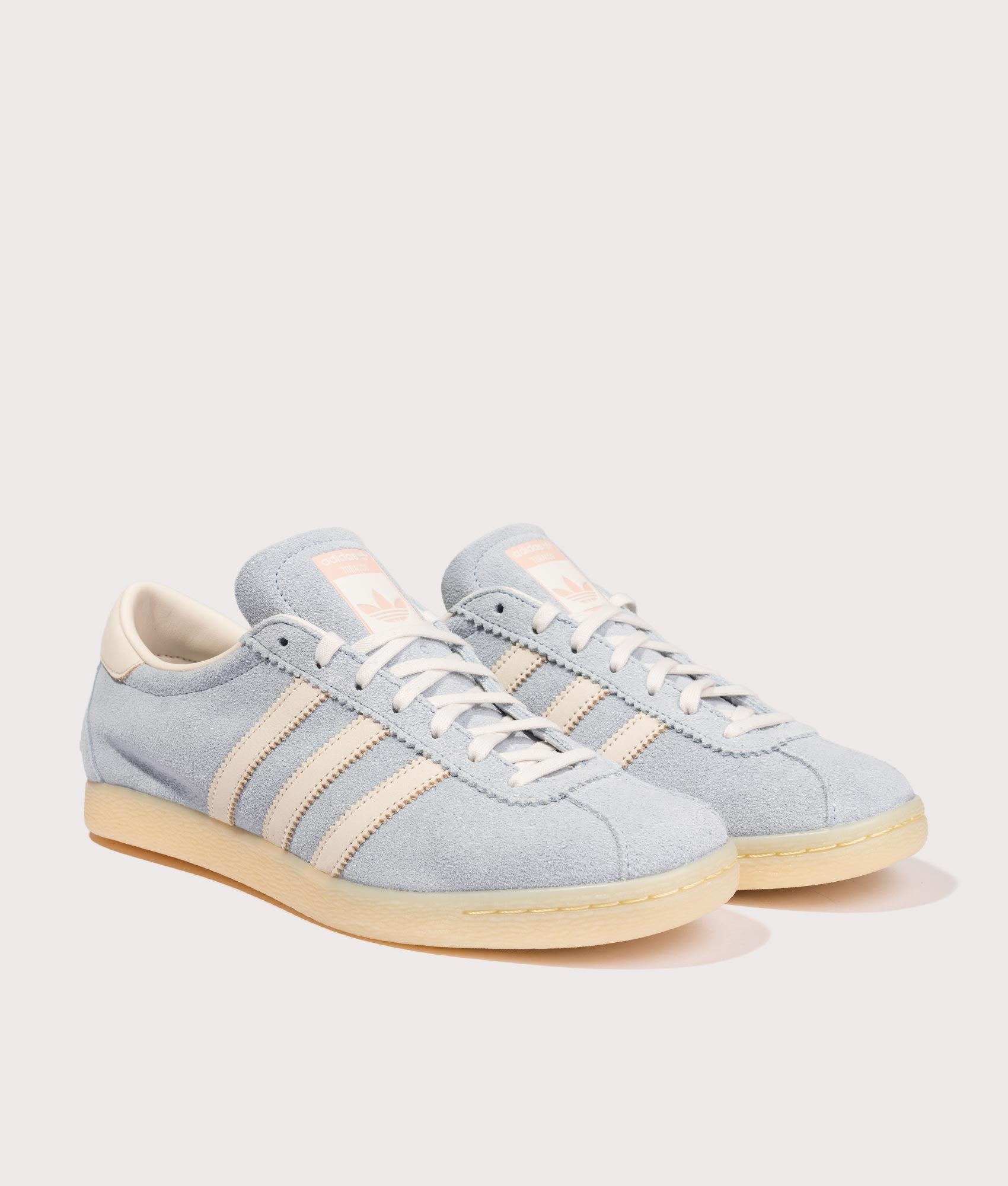 adidas Original Tobacco Trainers in Clear Sky, Chalk White and Almost Yellow at EQVVS Menswear. Angled front shot.
