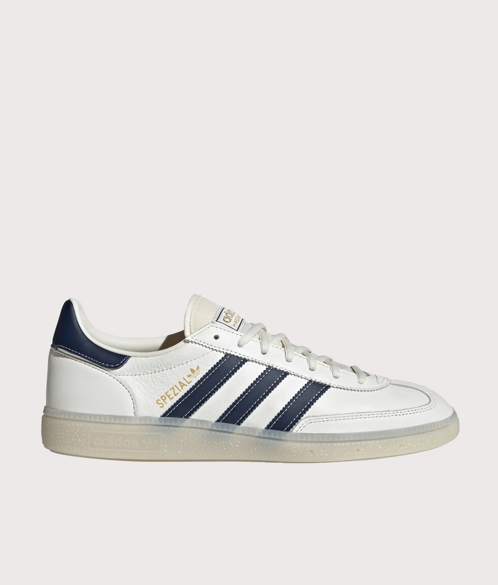 adidas Originals Handball Spezial Trainers in Core White, Night Indigo and Off White at EQVVS Menswear. Side shot.