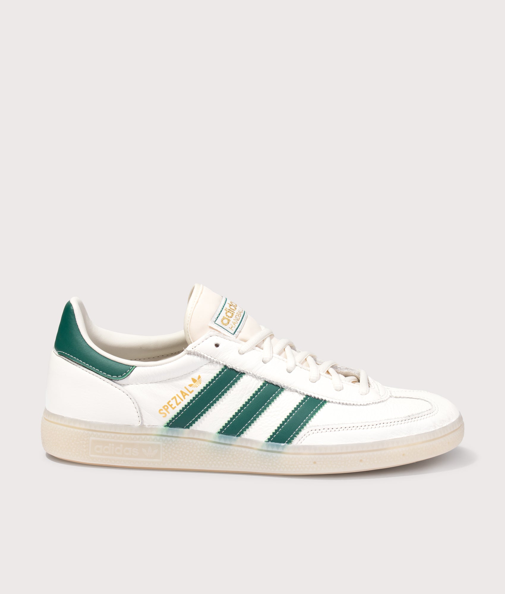 adidas Originals Handball Spezial Trainers in Core White, Collegiate Green and Off White at EQVVS Menswear. Side shot.