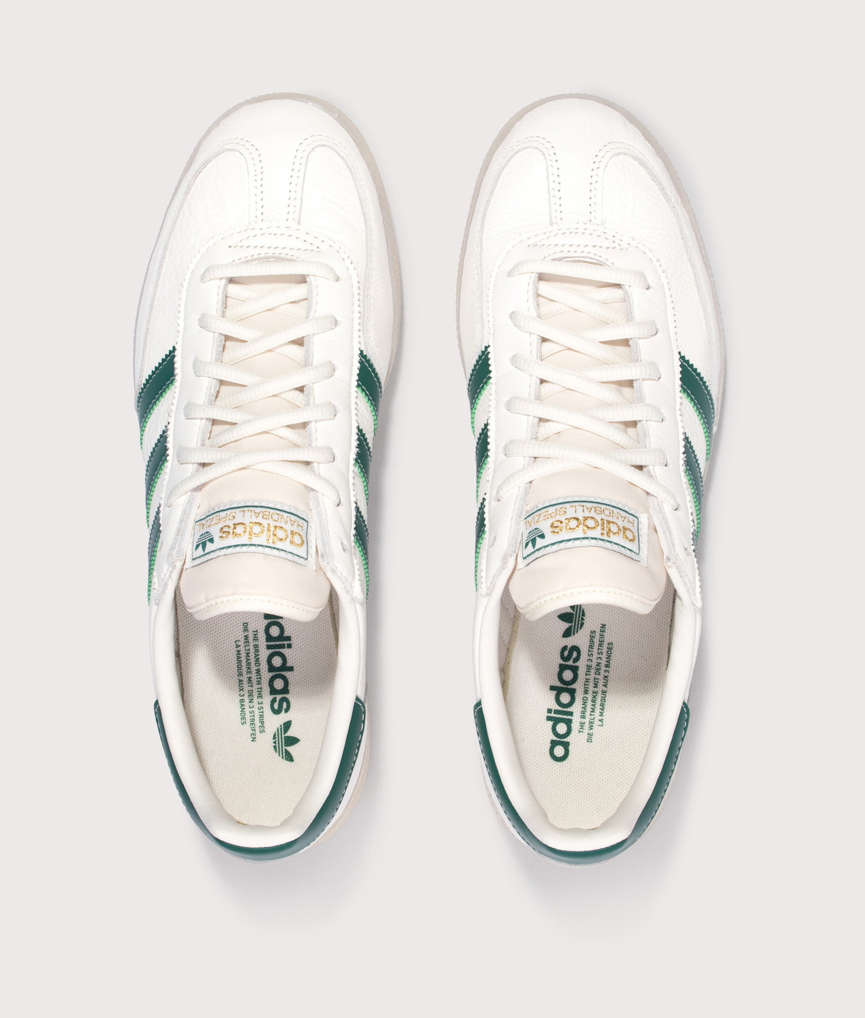 adidas Originals Handball Spezial Trainers in Core White, Collegiate Green and Off White at EQVVS Menswear. Top shot.