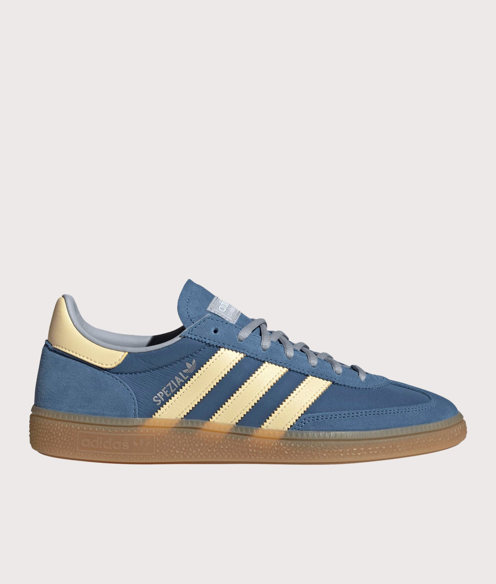 adidas Originals Handball Spezial Trainers in Dusky Ink / Easy Yellow at EQVVS Menswear. Side shot.