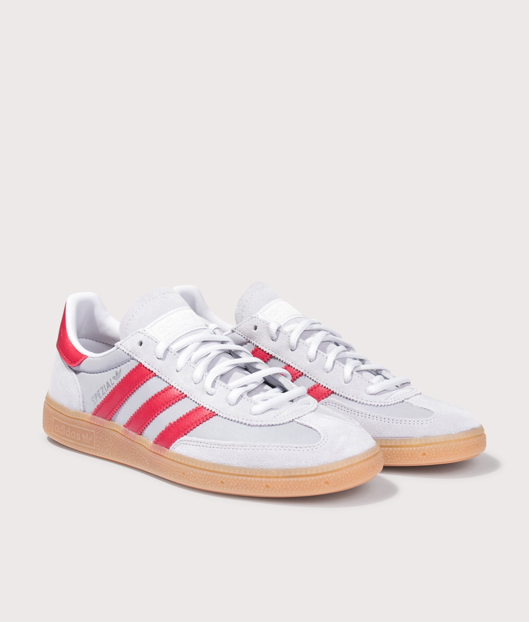 adidas Originals Handball Spezial Trainers in Halo Silver, Team Victory Red and Gum4 at EQVVS Menswear. Angled front shot.