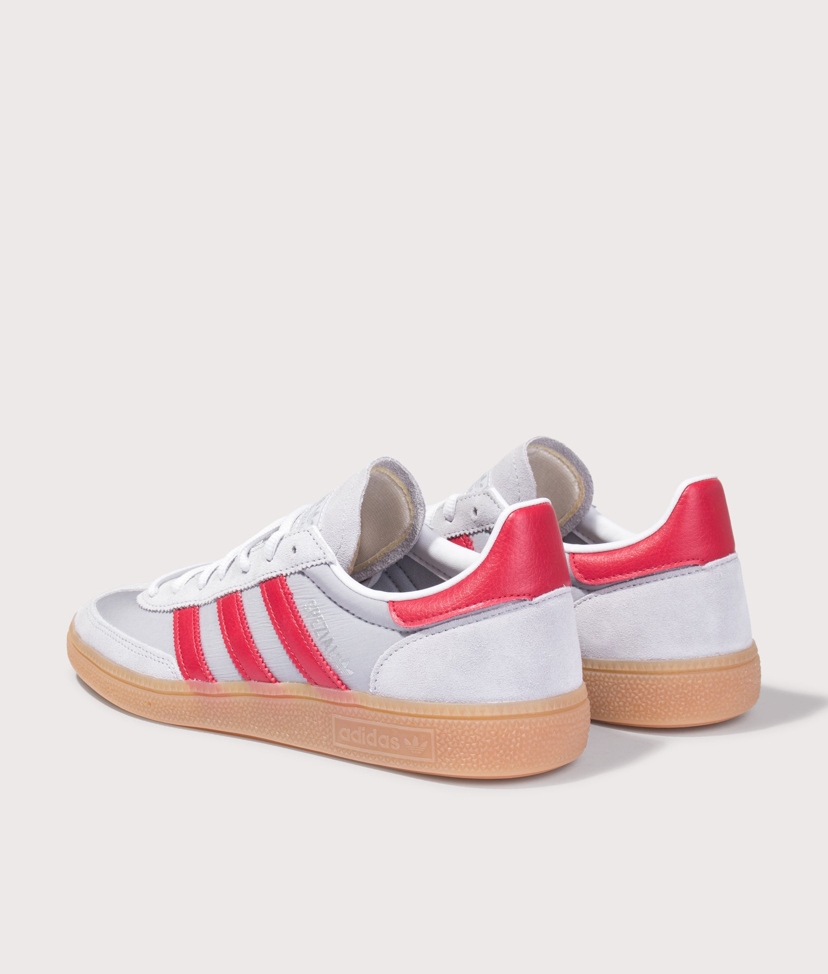 adidas Originals Handball Spezial Trainers in Halo Silver, Team Victory Red and Gum4 at EQVVS Menswear. Angled back shot.