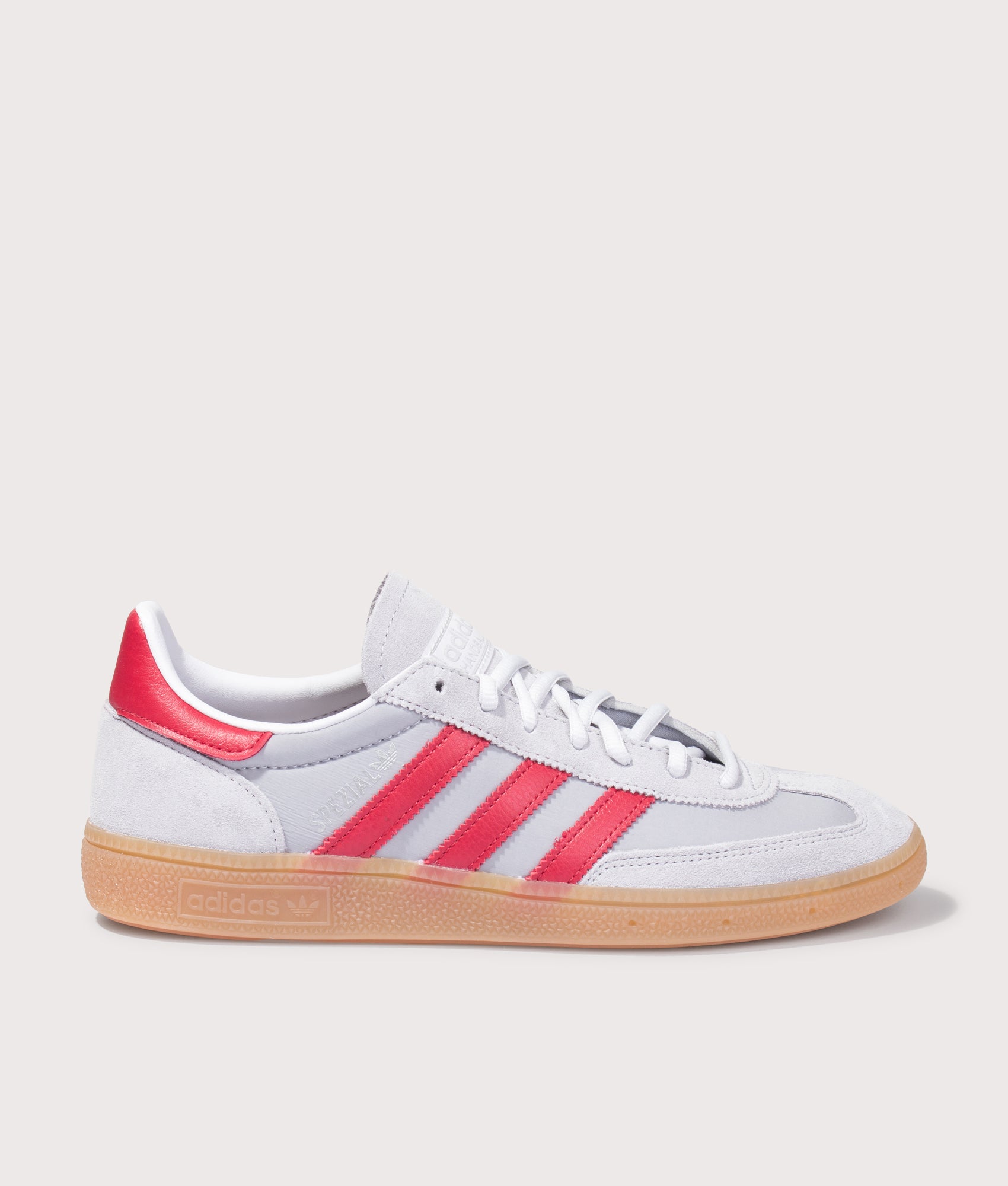 adidas Originals Handball Spezial Trainers in Halo Silver, Team Victory Red and Gum4 at EQVVS Menswear. Side shot.