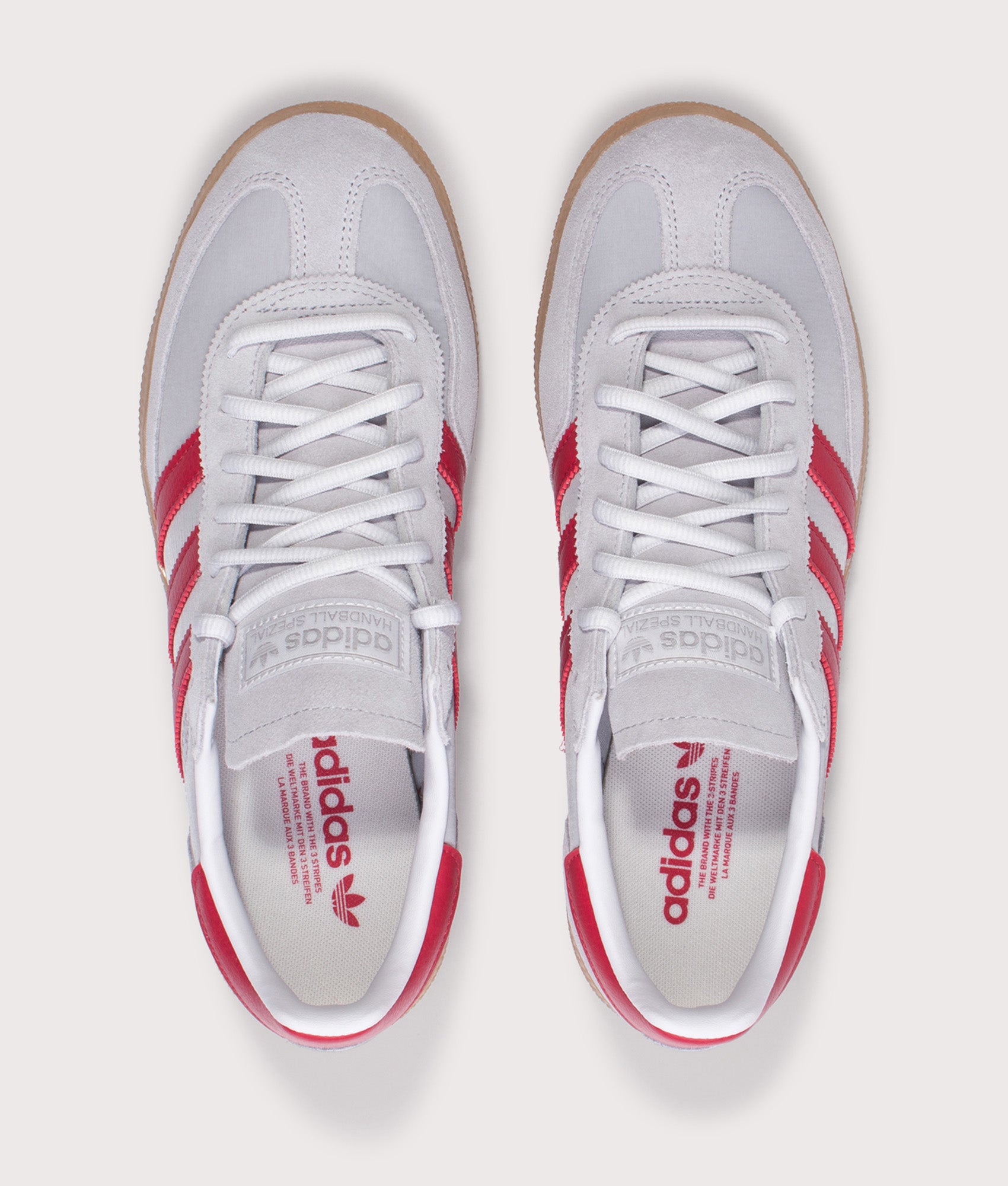 adidas Originals Handball Spezial Trainers in Halo Silver, Team Victory Red and Gum4 at EQVVS Menswear. Top shot.