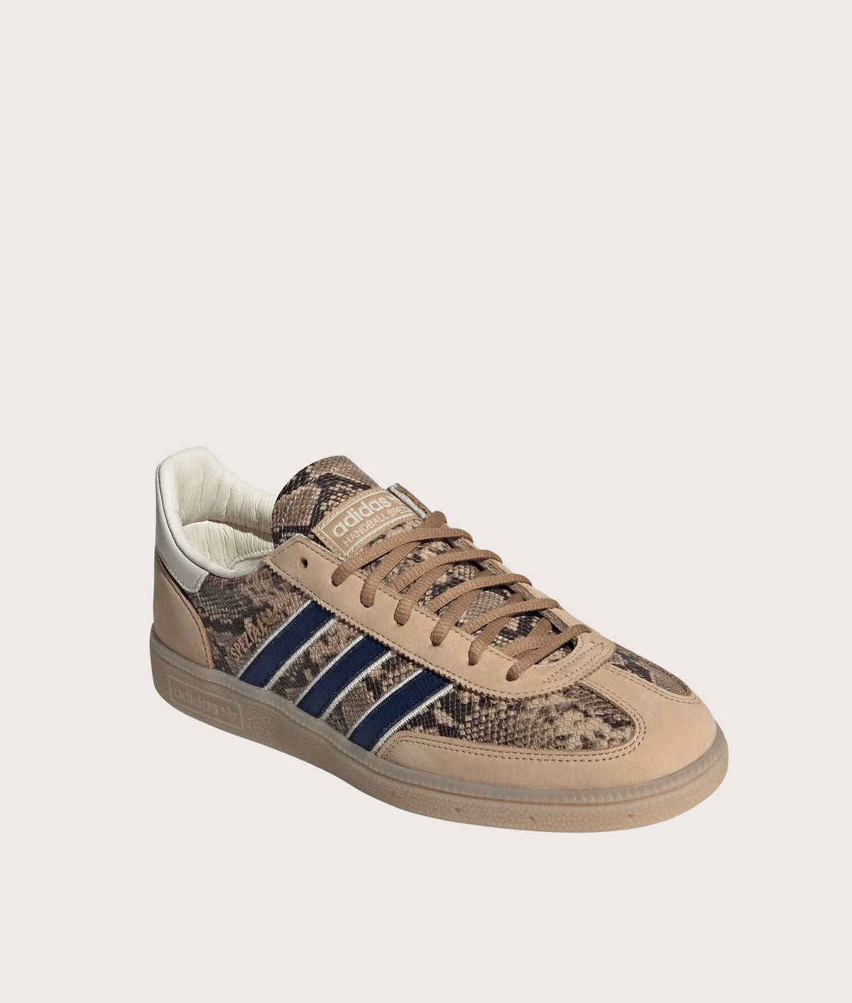 adidas Originals Snake Print Handball Spezial Trainers in Warm Sandstone, Dark Blue and Cardboard at EQVVS Menswear. Angled front shot.