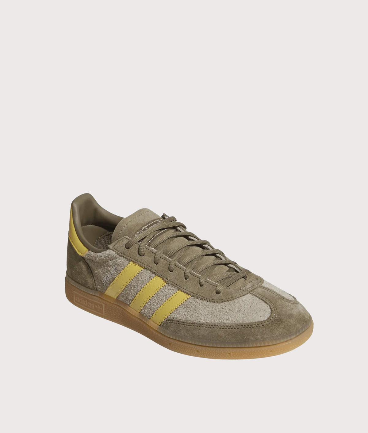 adidas Originals Handball Spezial Trainers  in Olive Strata, Pyrite and Gum 4 at EQVVS Menswear. Angled front shot.